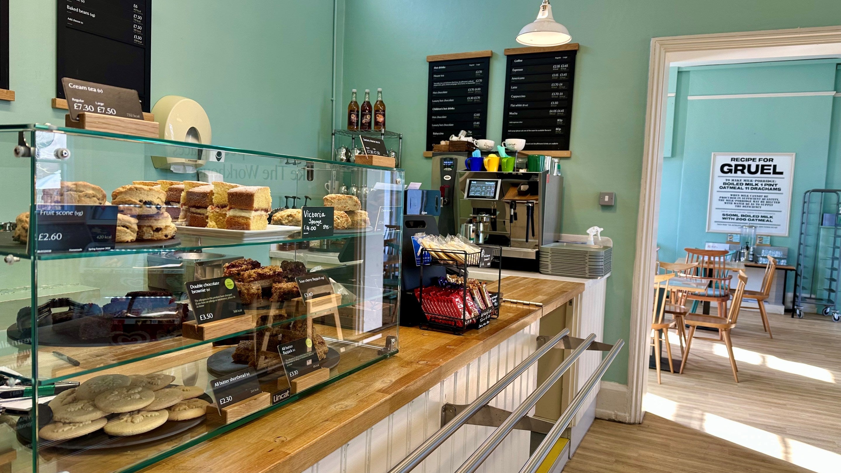 The cafe counter with cakes and coffee machine