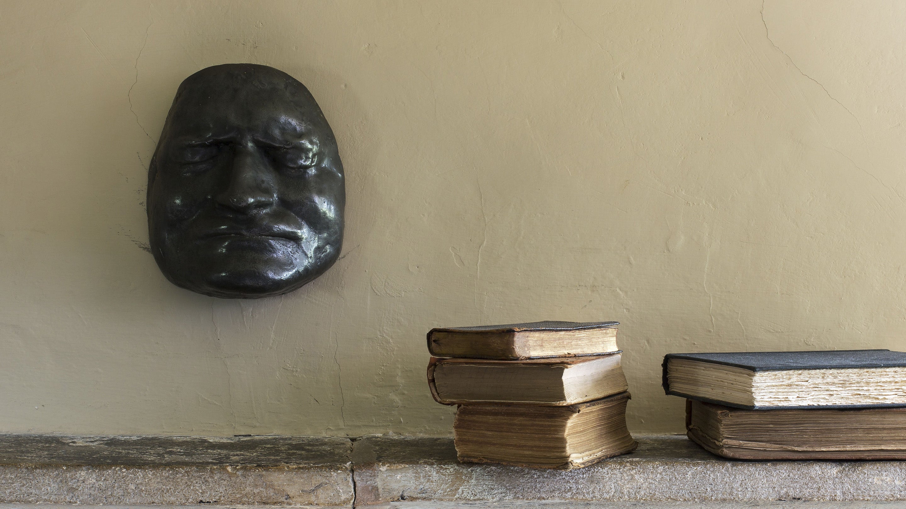 The death mask of Sir Isaac Newton on the wall at Woolsthorpe Manor, Lincolnshire