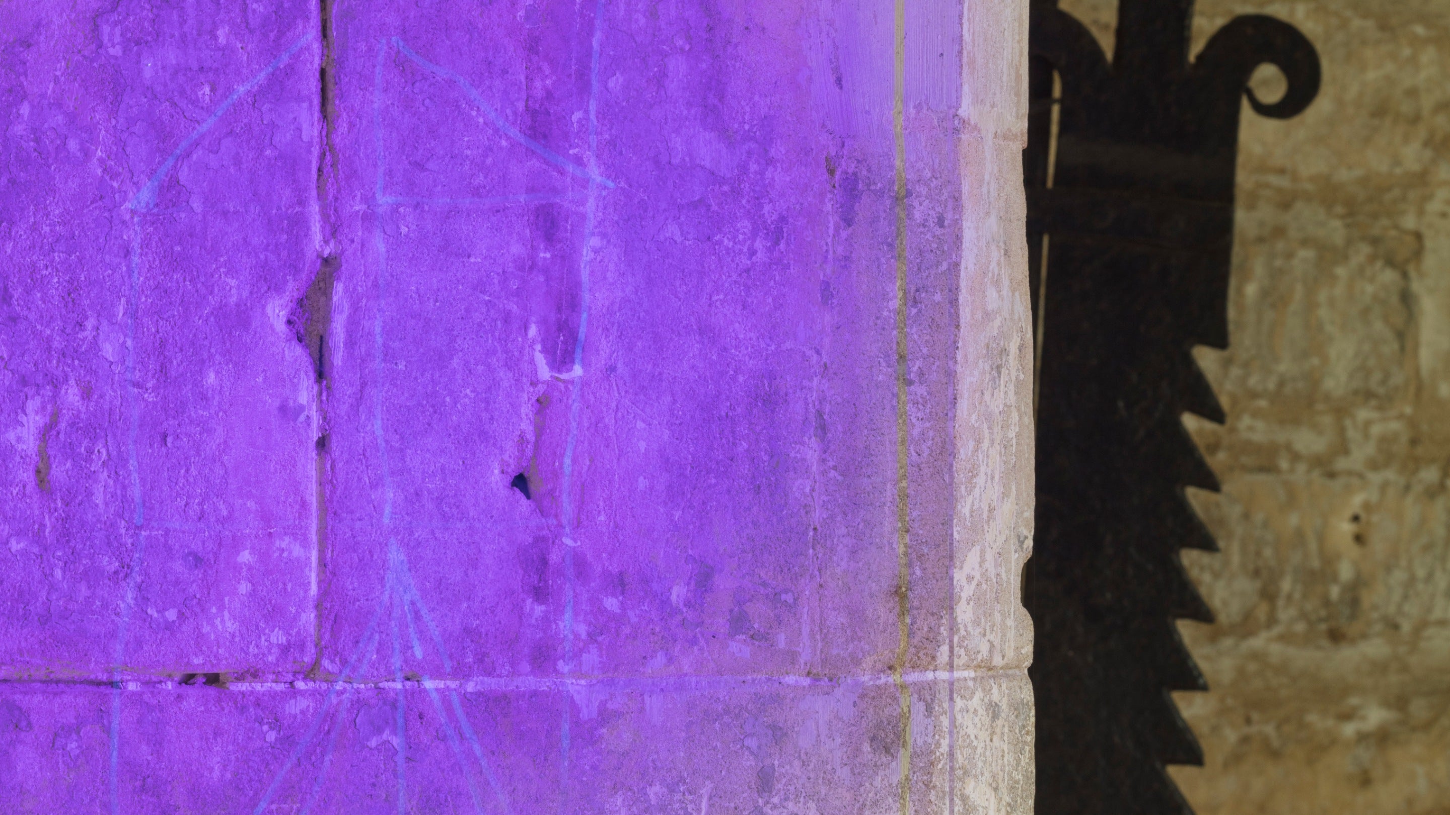 Graffiti depicting a postmill, under UV light near the fireplace in the Entrance Hall at Woolsthorpe Manor, Lincolnshire