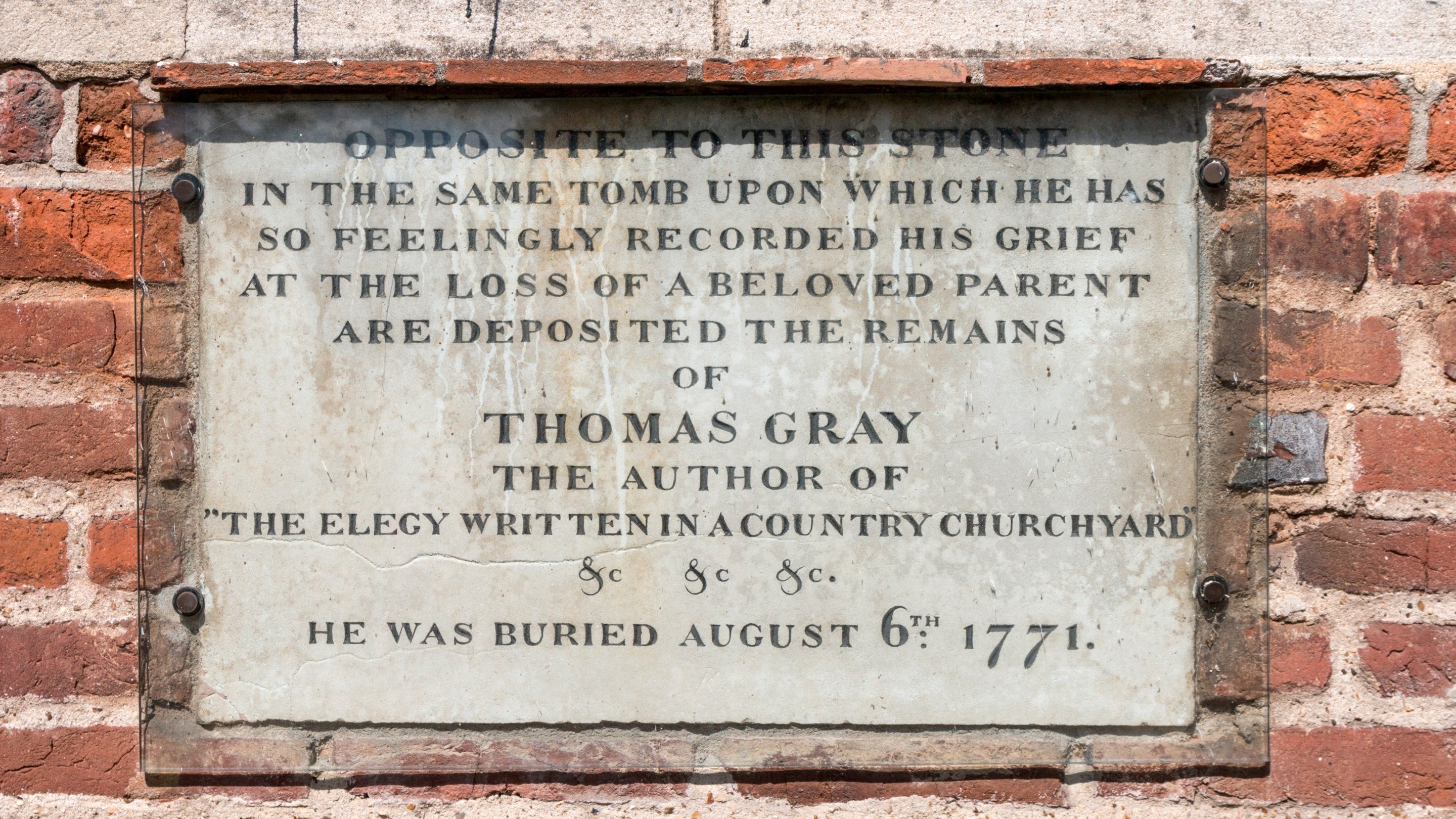 Memorial plaque to Thomas Gray on the exterior of St. Giles' Church in Stoke Poges, Buckinghamshire