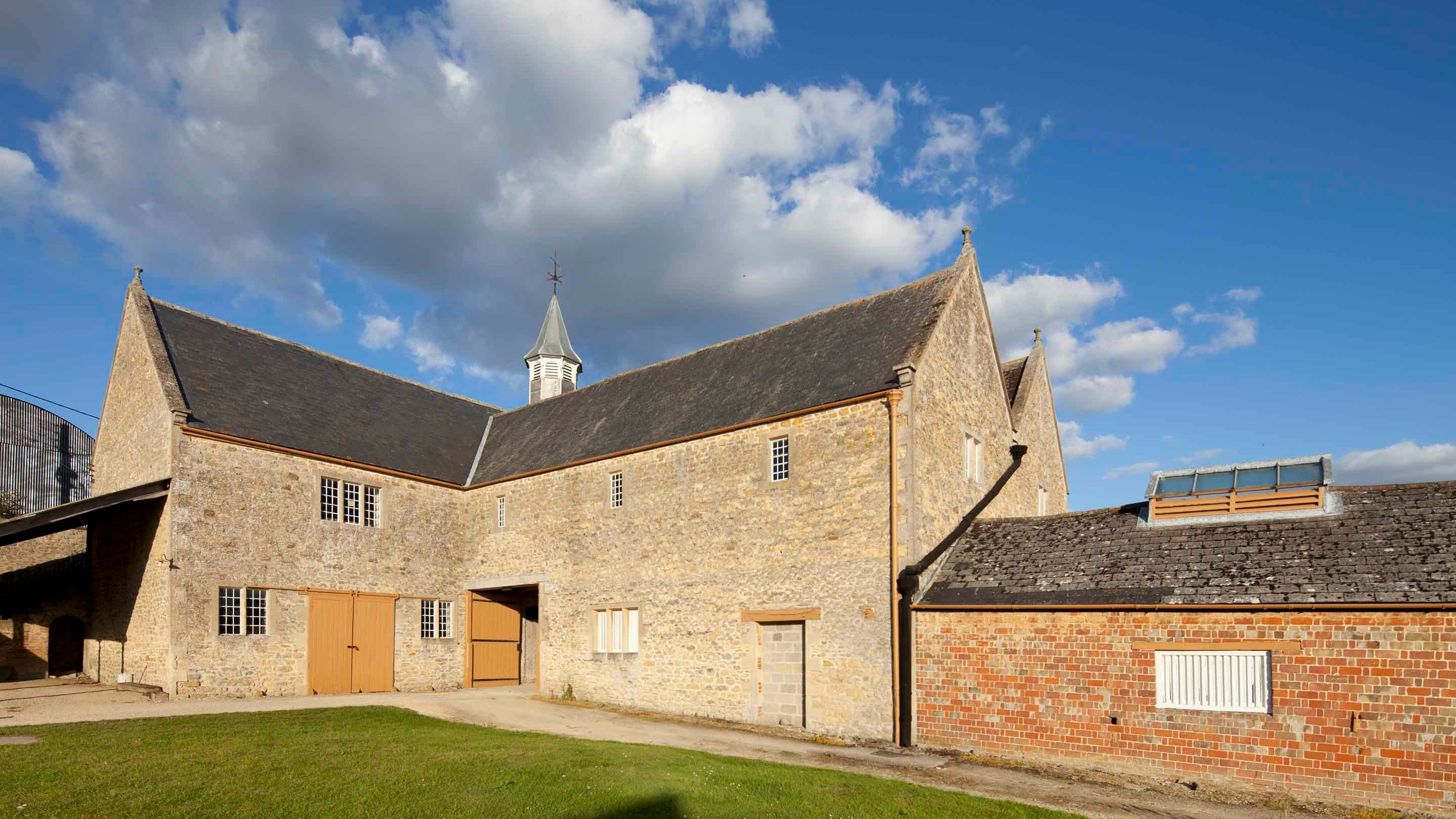 A pair of stone built Victorian Model Farm buildings at Coleshill in Oxfordshire