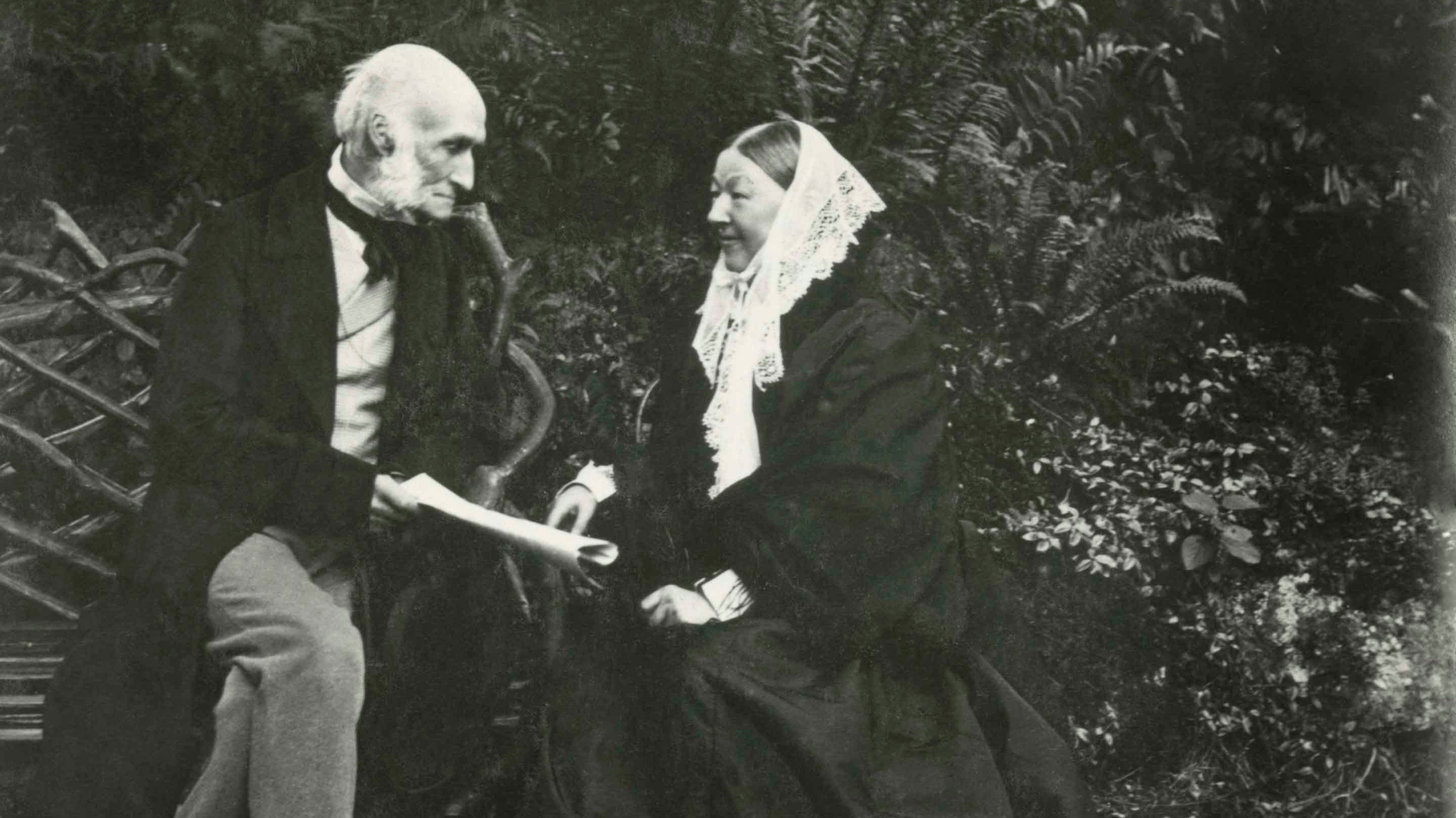 A black and white photographic print of Florence Nightingale and Sir Harry Verney sitting on a bench at Claydon, Buckinghamshire