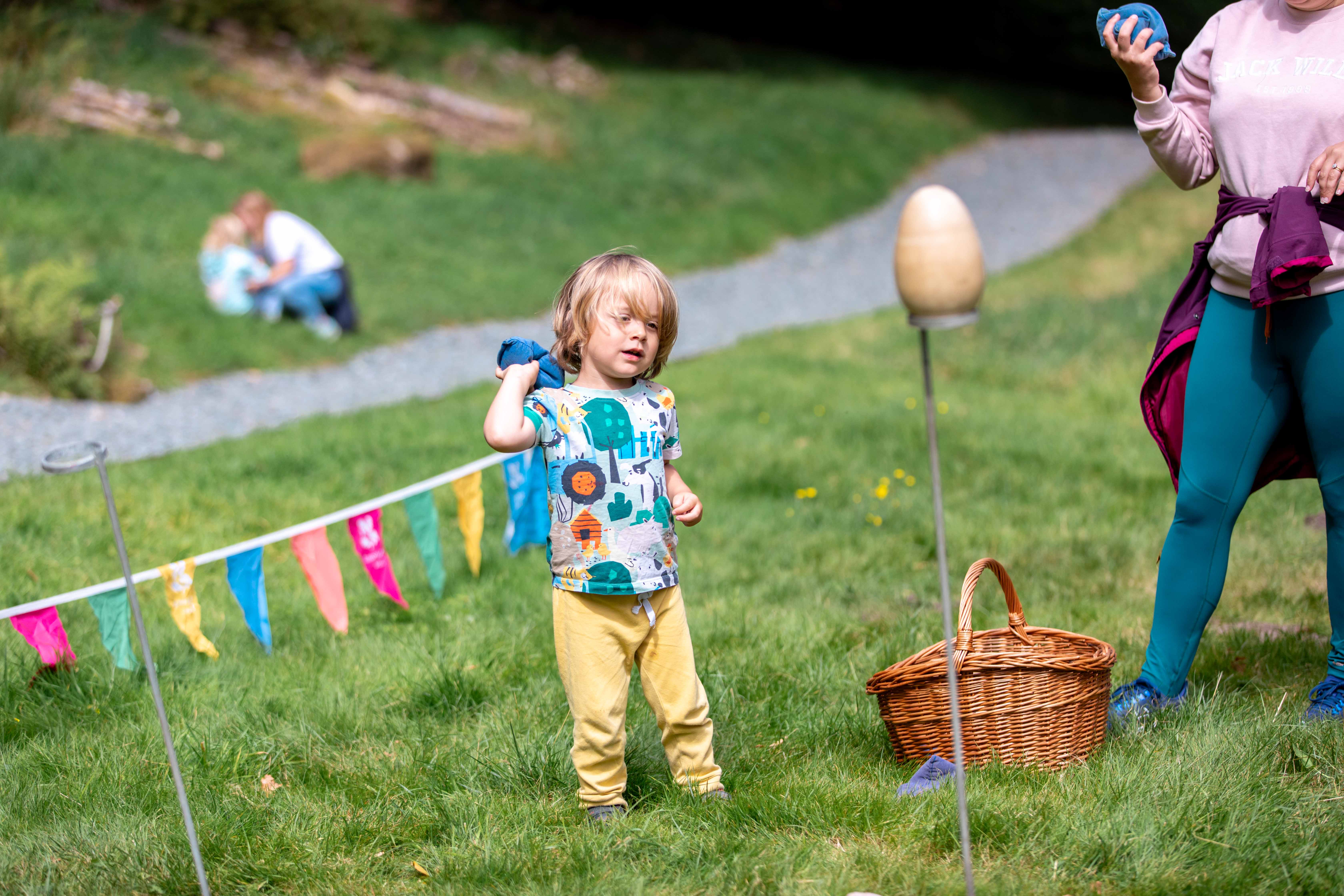 Bean bag toss during Summer of Play event