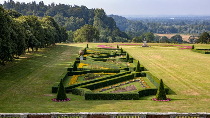 A view of the ornamental hedges and planting of the parterre at Cliveden, Buckinghamshire