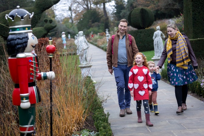 Visitors admiring the giant Nutcrackers in the Long Garden