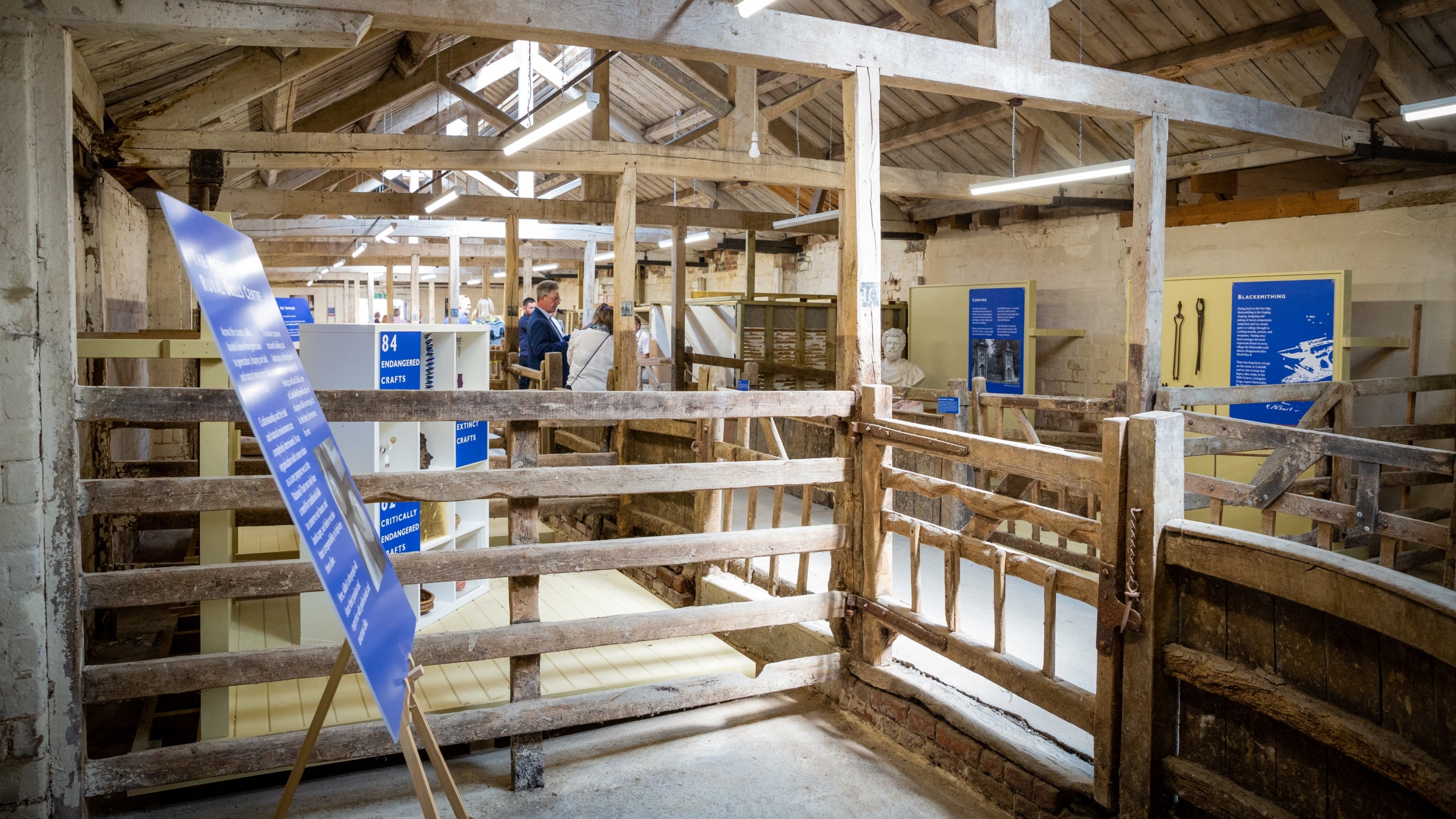Visitors looking around the exhibition in a converted farm building at the Heritage and Rural Skills Centre, Oxfordshire