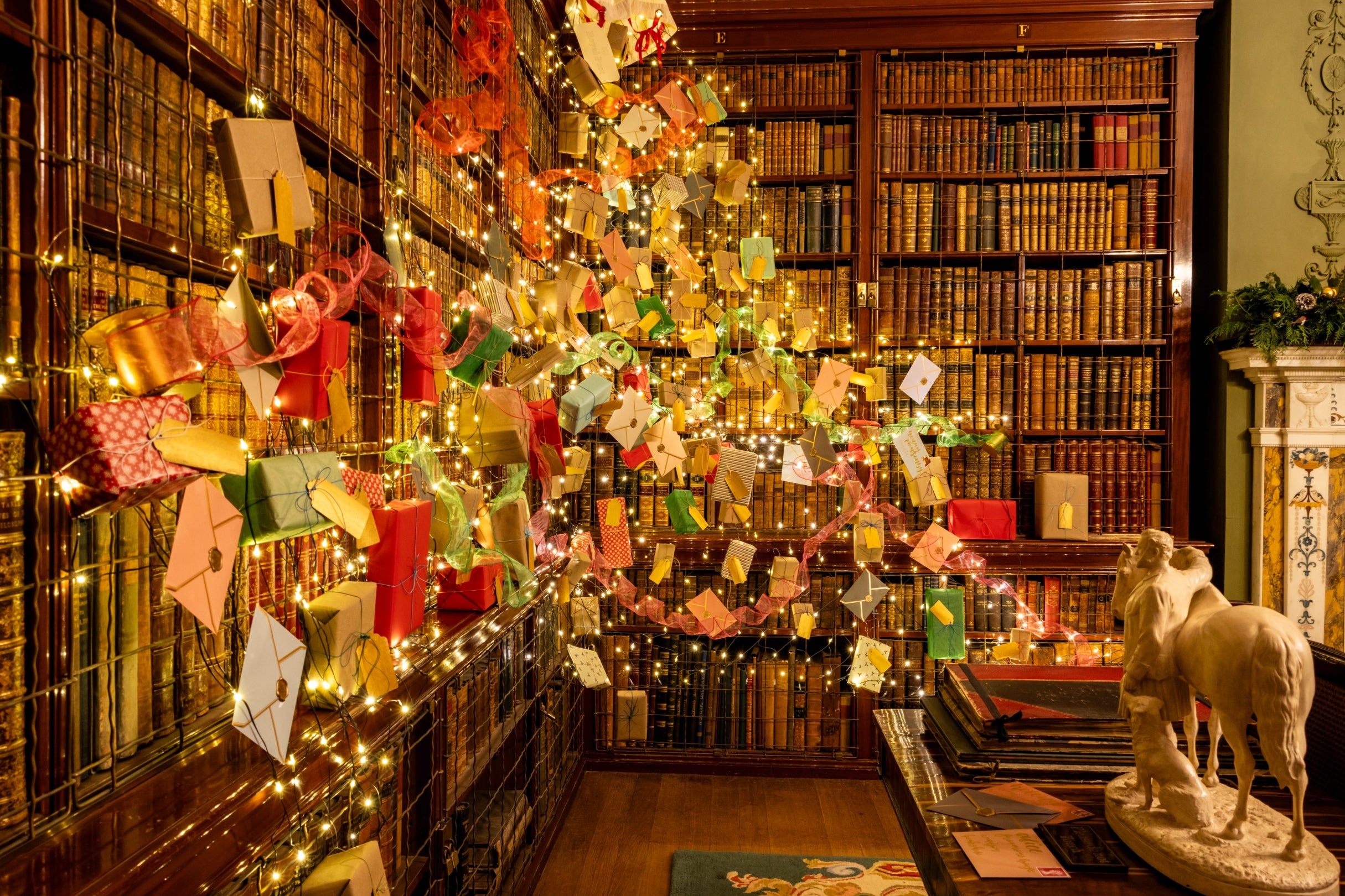 Net lights covered in parcels and letters attached to the bookcases in the Library at Hughenden