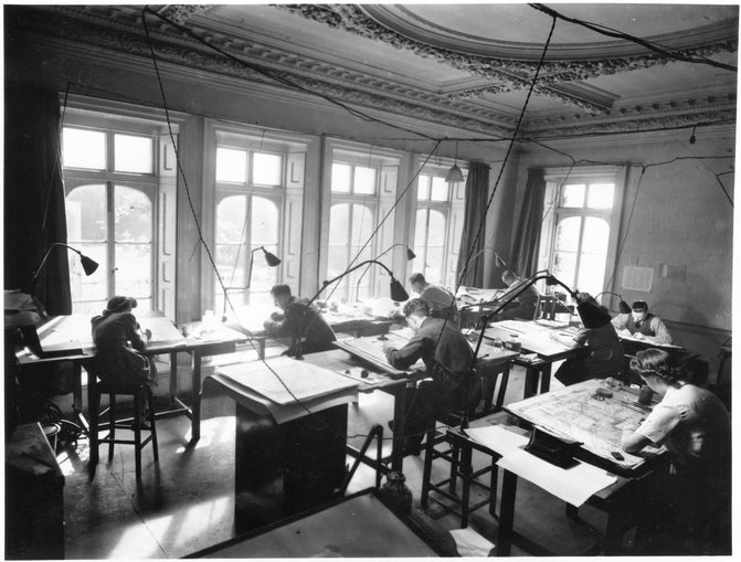 Black and white image of mapmakers at desks during Hillside.