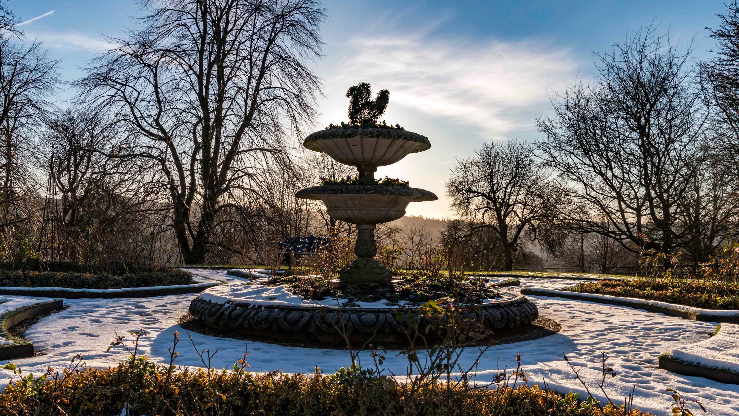 The fountain in the parterre garden in winter at Hughenden, Buckinghamshire