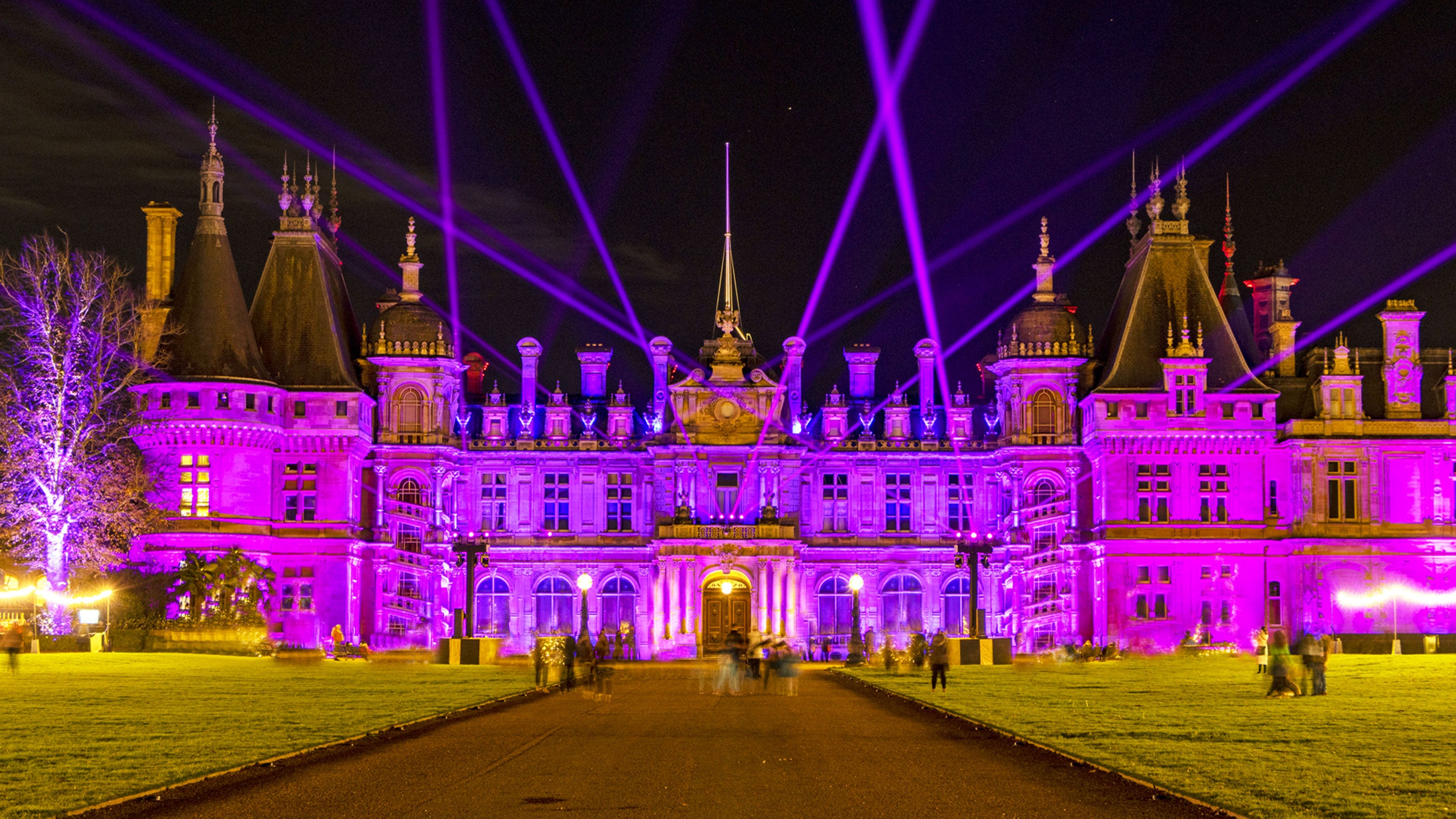 Waddesdon manor illuminated with pink light