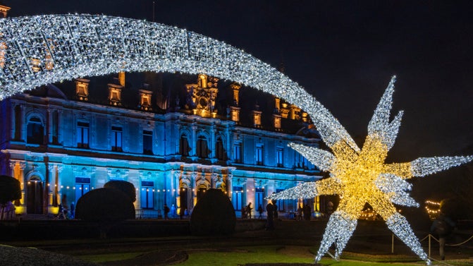 A Christmas star-shaped outdoor illumination lights up the garden at Waddeson, Buckinghamshore