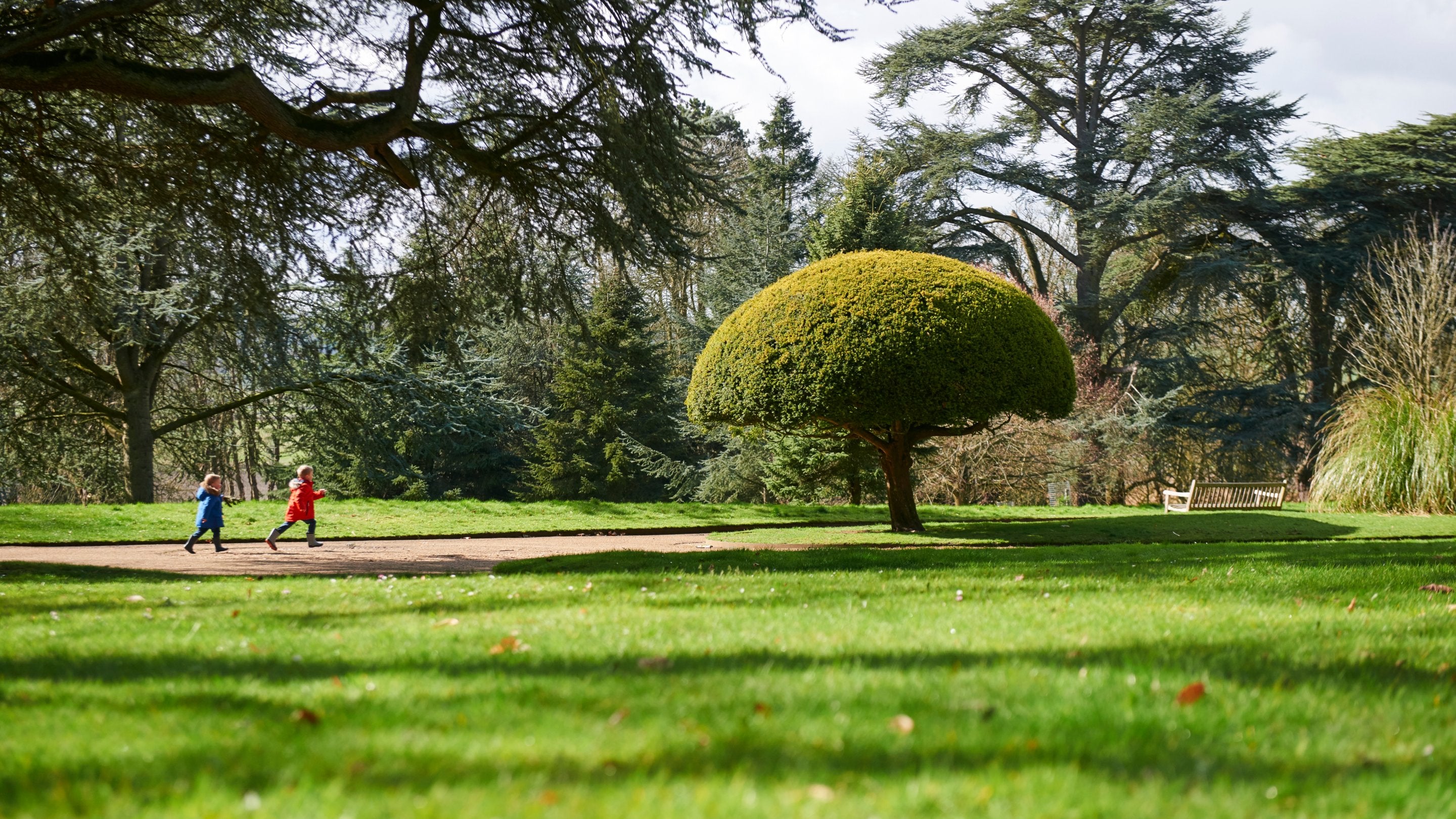 Children in the garden in spring at Waddesdon Manor, Buckinghamshire
