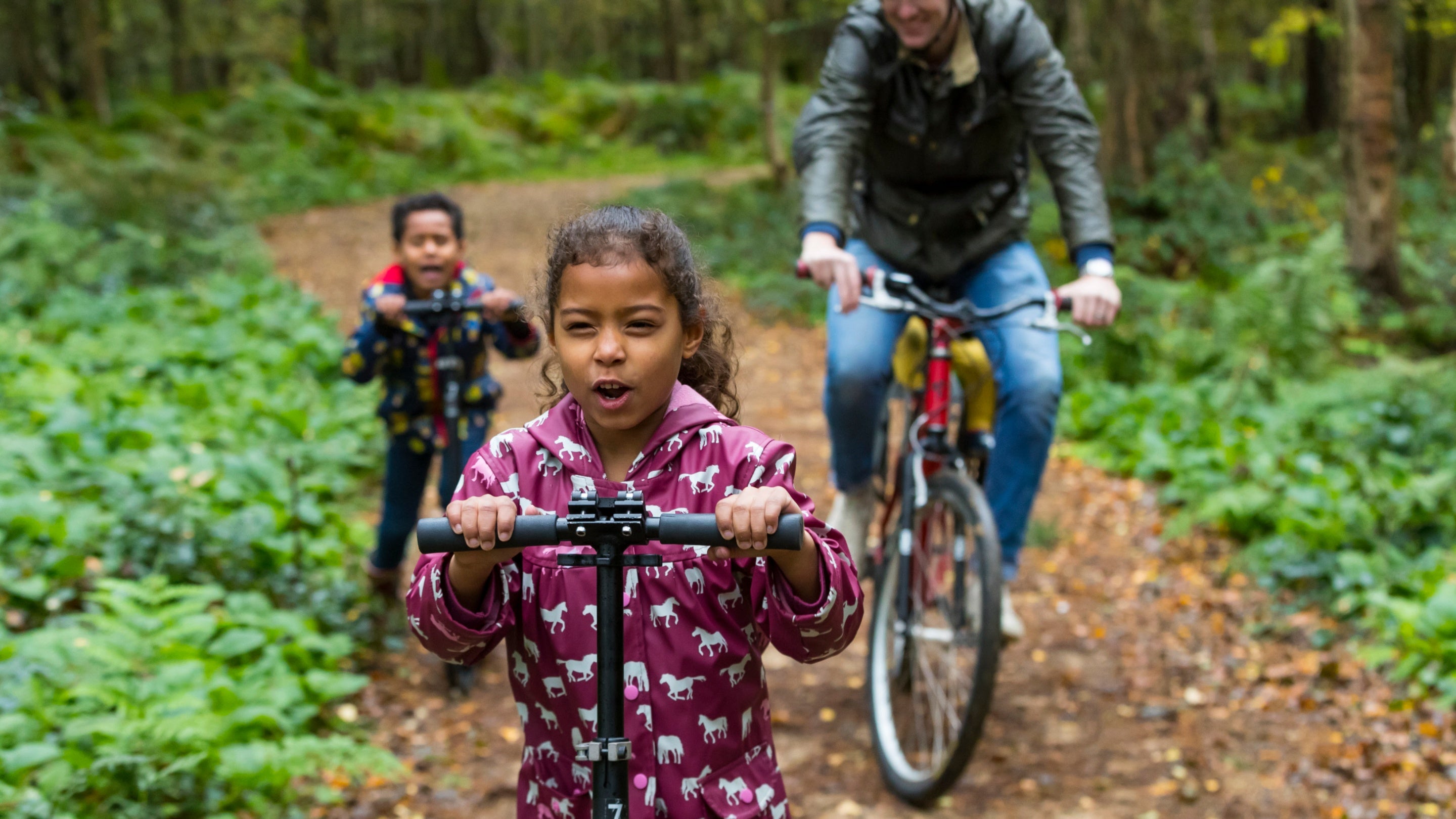 A family follow the cycle trail at Calke Abbey, Derbyshire