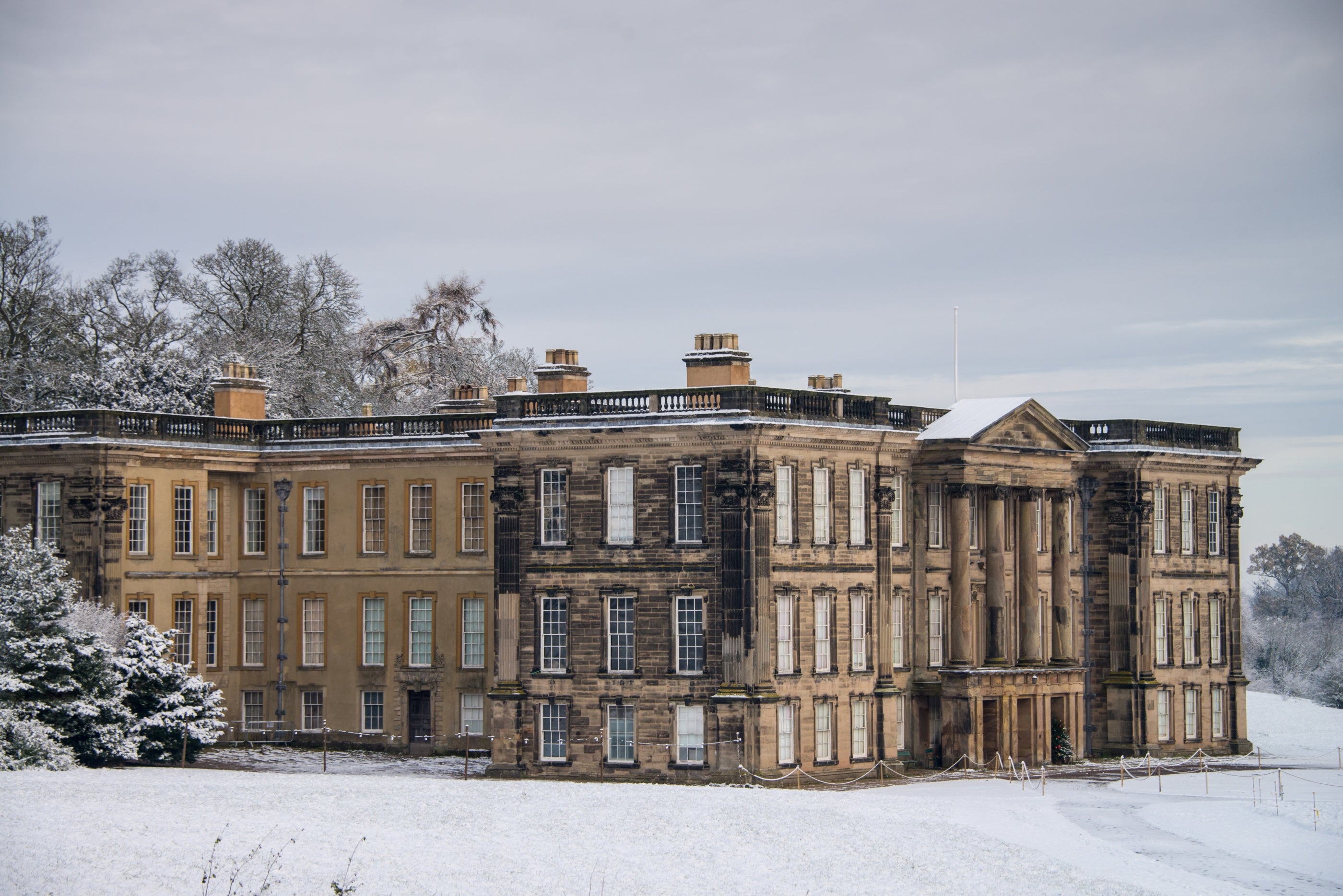 Calke Abbey, Derbyshire, in the snow, viewed from parkland