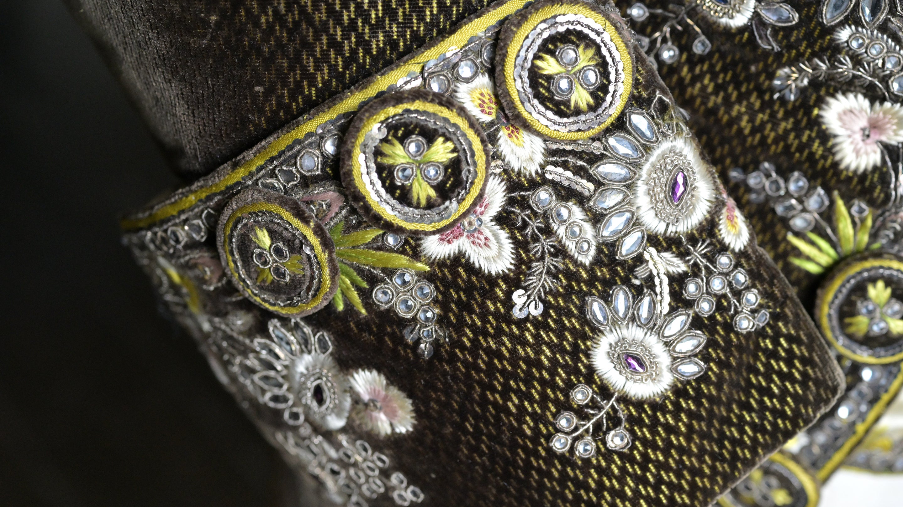 A decorative sleeve on a coat in the costume collection at Calke Abbey Derbyshire