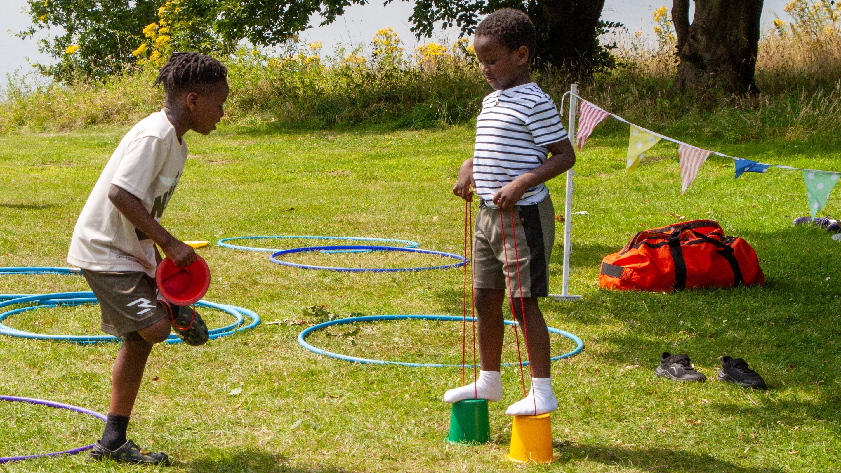 Children walking on beginner's stilts