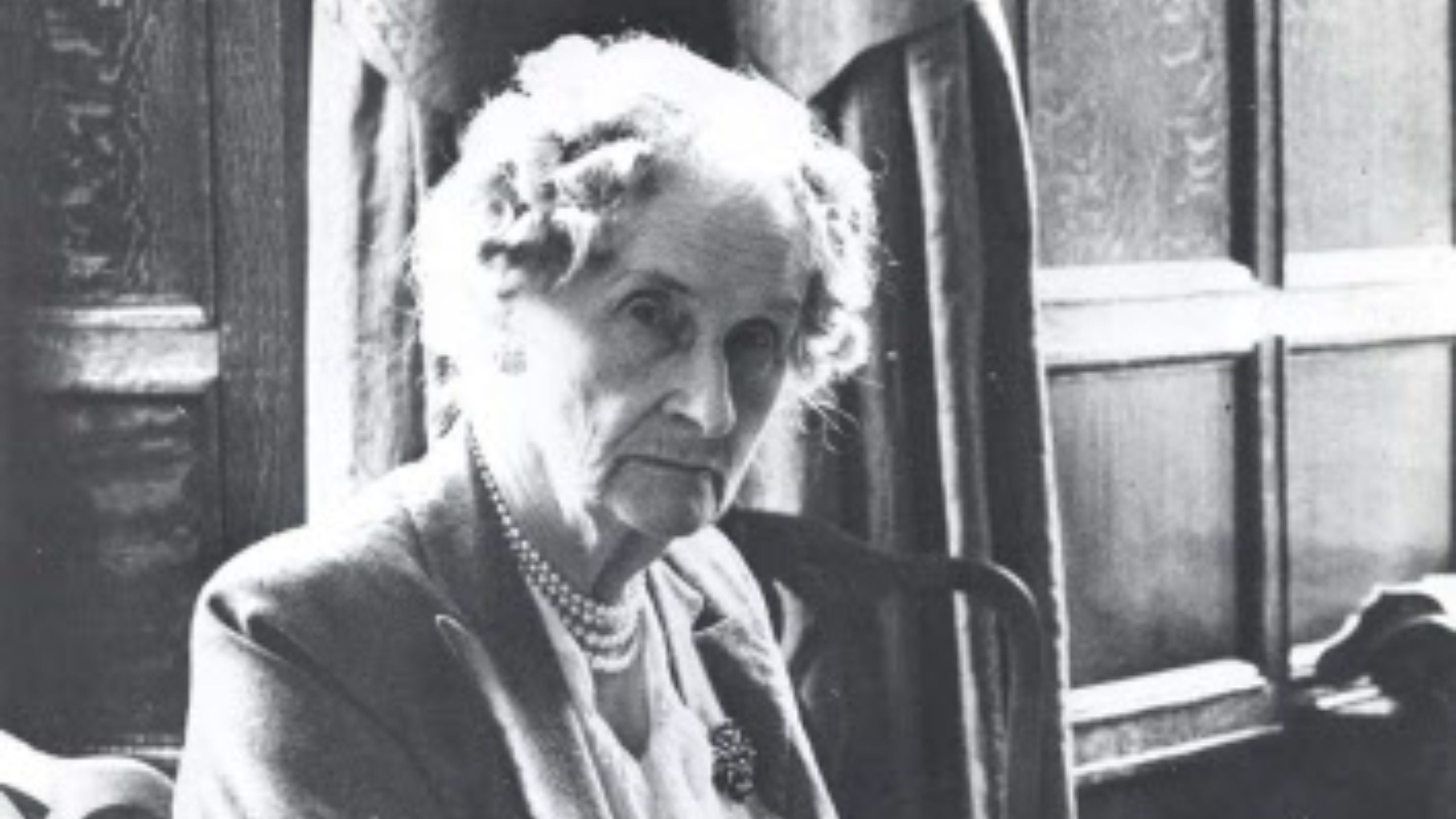 Evelyn, Duchess of Devonshire, 1870-1960, at Hardwick Hall, Derbyshire, repairing a tapestry