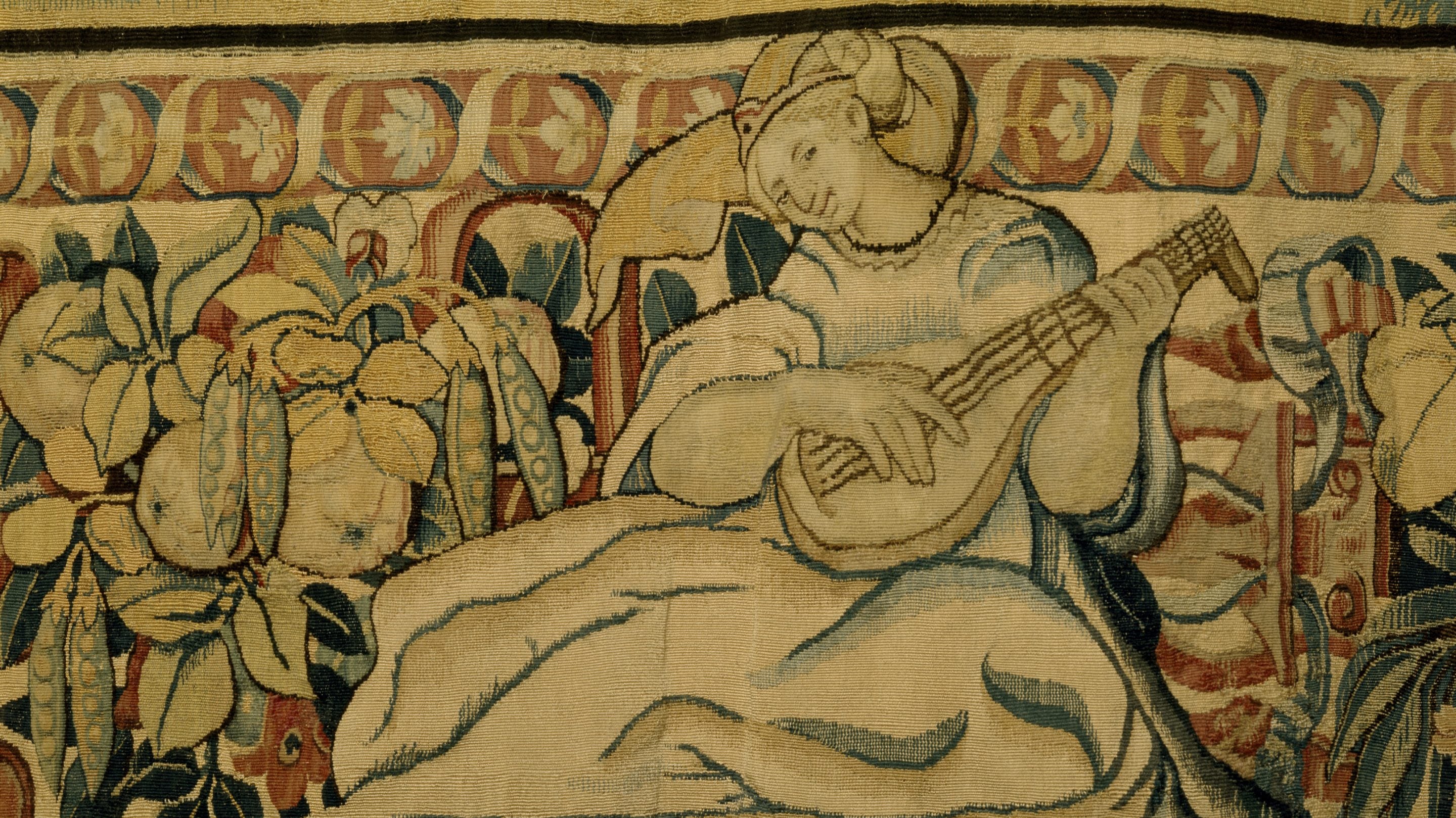 Detail from one of the Ulysses tapestries made in Brussels, hanging in the High Great Chamber. It depicts a female musician strumming a mandolin.