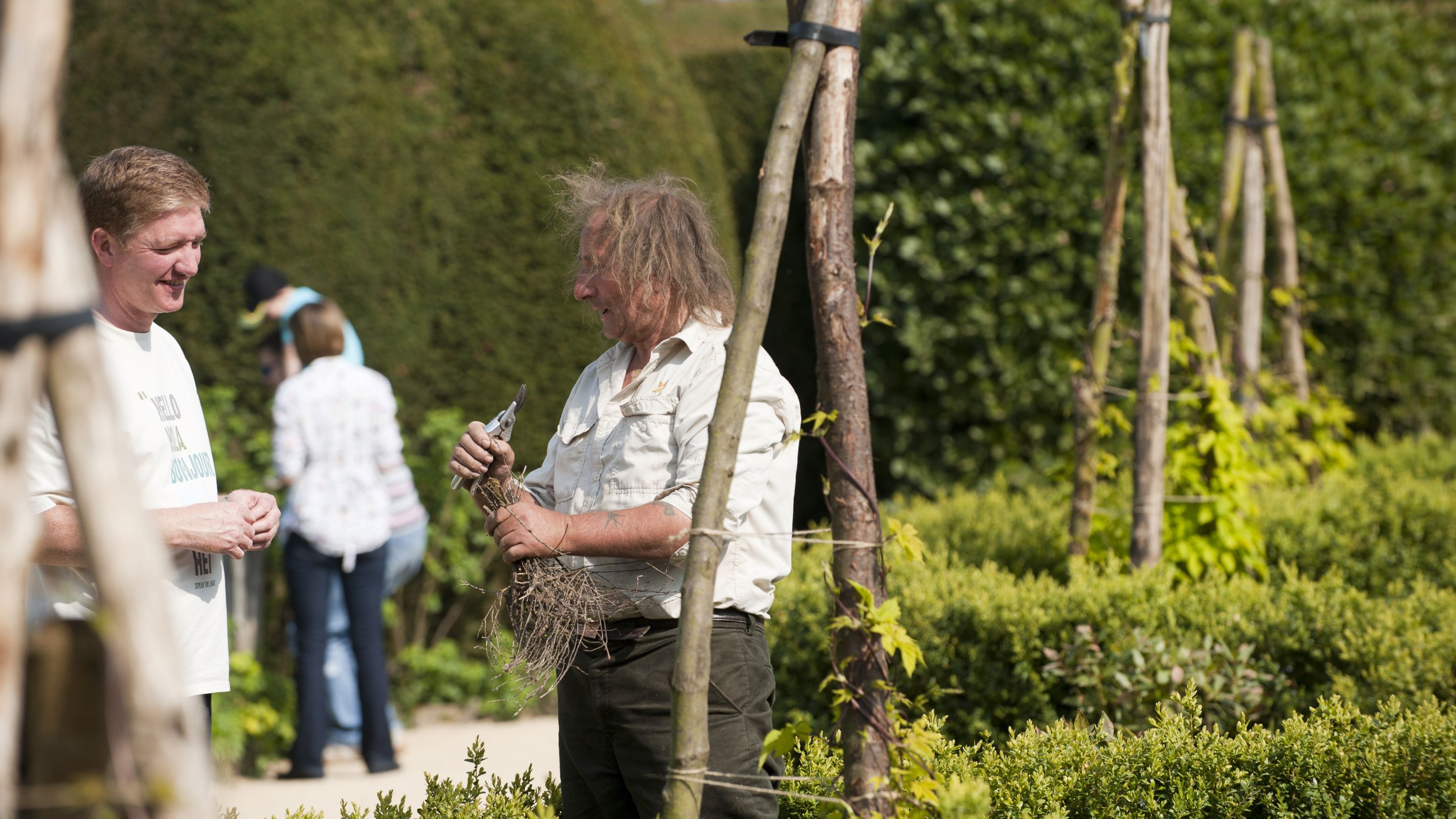 Garden volunteer answering questions in the Hardwick gardens