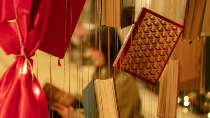 Reading and suspended book display at Hardwick, Derbyshire