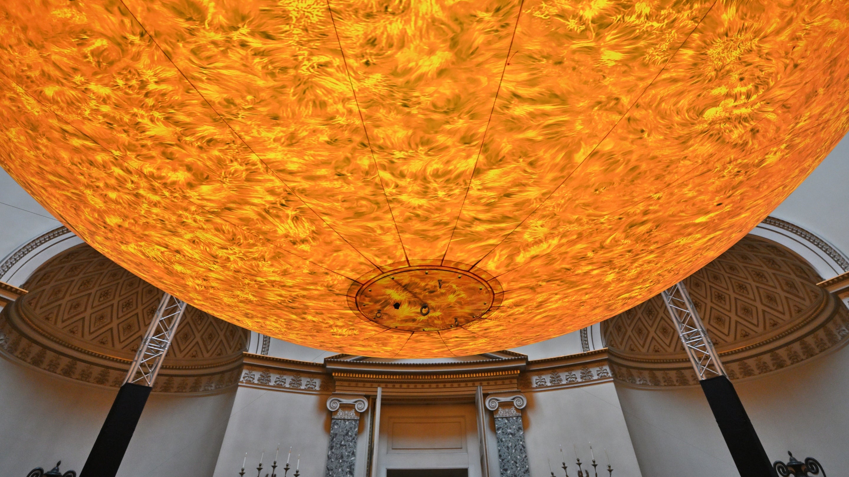 A 7 metre artwork of the sun is suspended in from the ceiling at Kedleston Hall