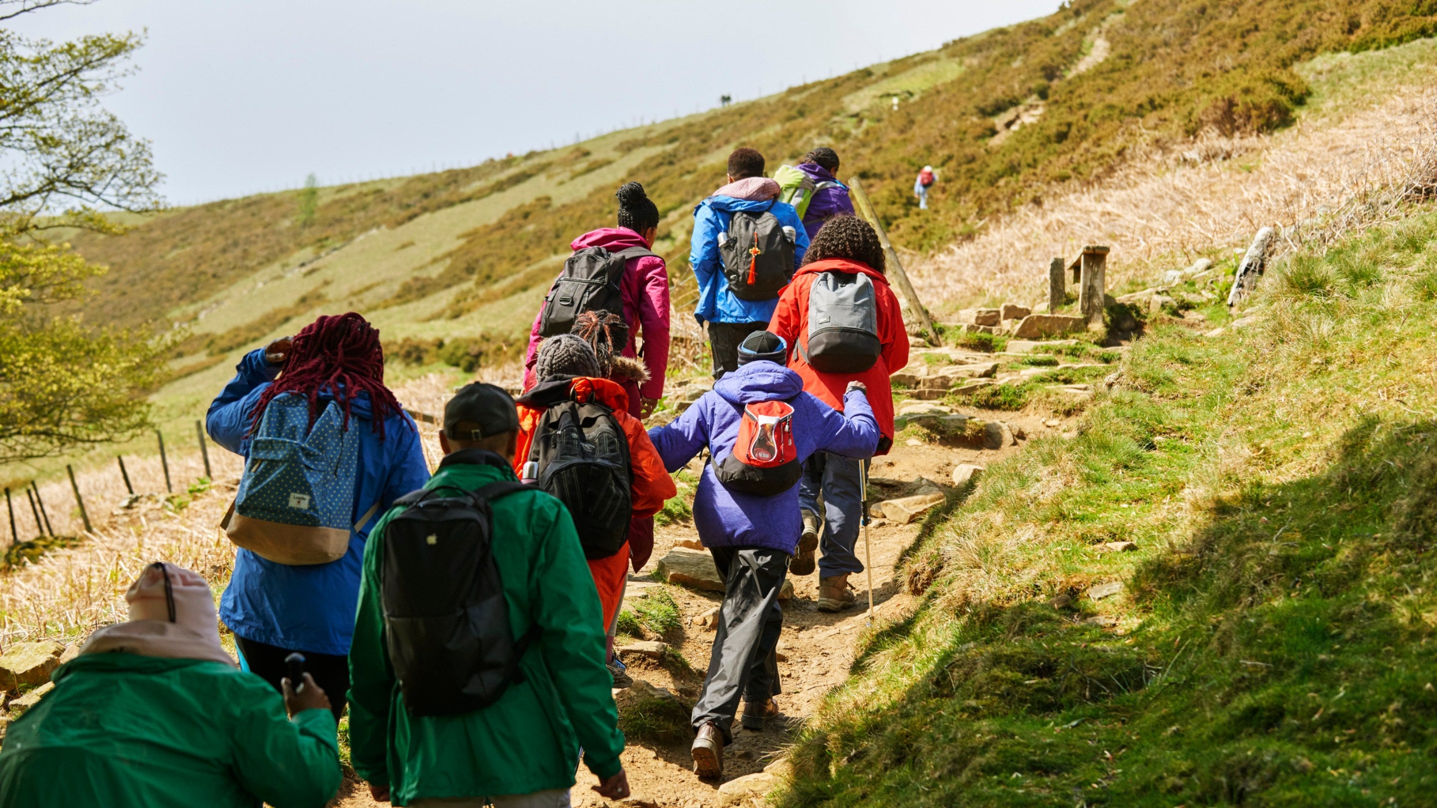 A group walk on Mam Tor, Peak District, Derbyshire