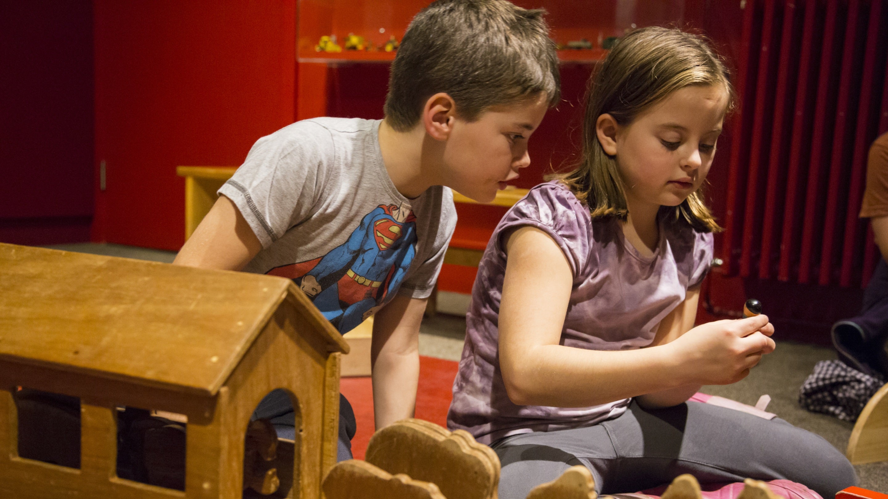 A brother and sister playing in the activity area in The Children's Country House, Sudbury, Derbyshire