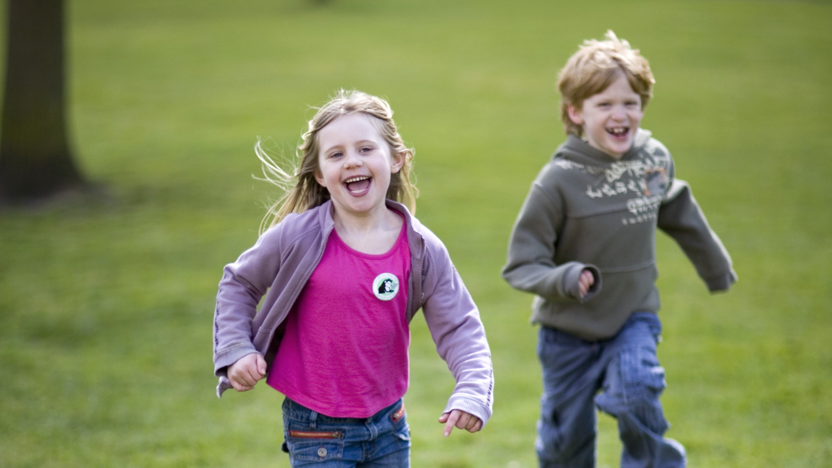 Children running in the garden at The Children's Country House at Sudbury, Derbyshire