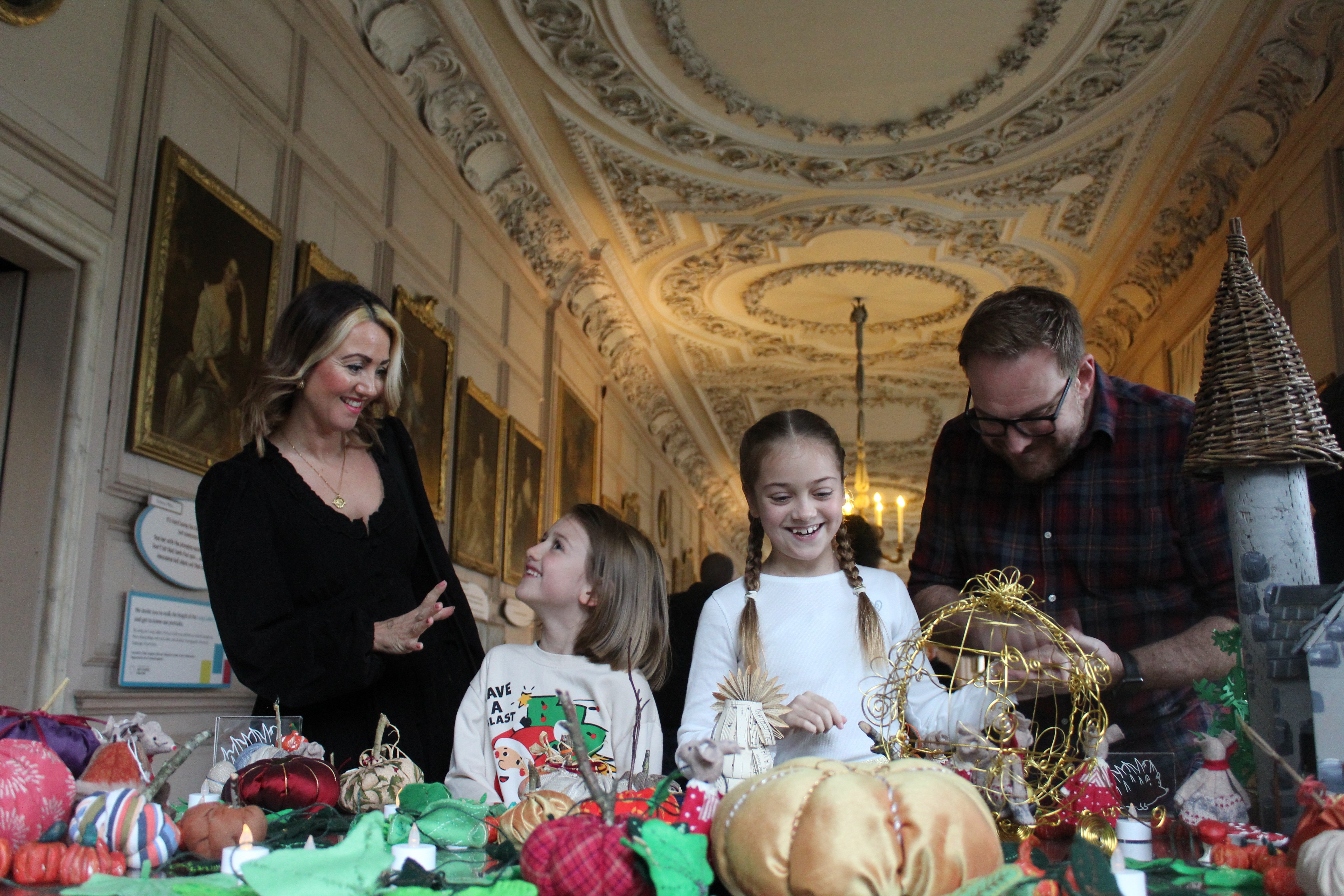 Family enjoying Christmas in Long Gallery