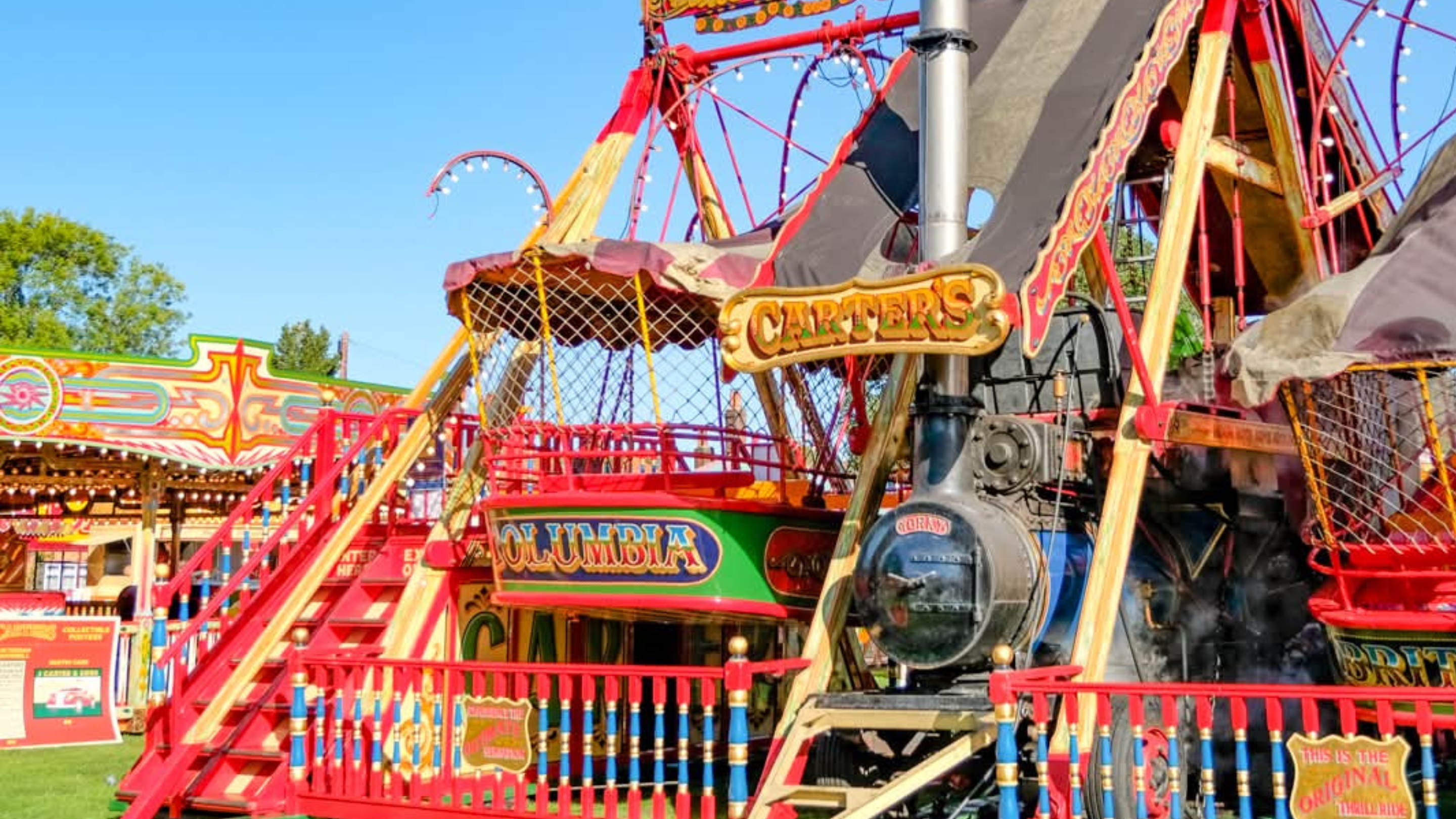 Lakin Amusements' Excelsior Steam Yachts in front of a blue sky.