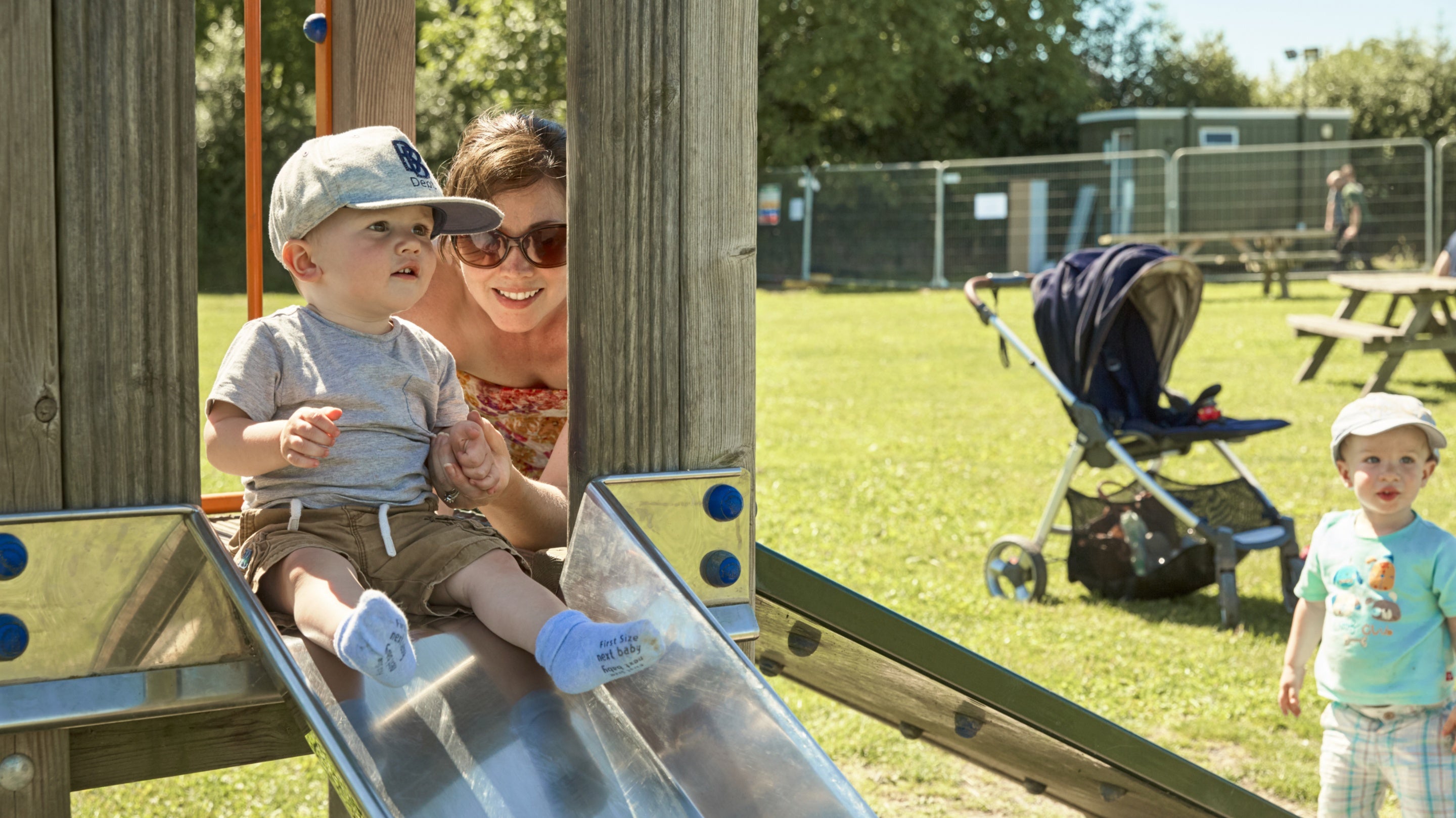 Visitors in the children's play area at Attingham Park, Shropshire in summer