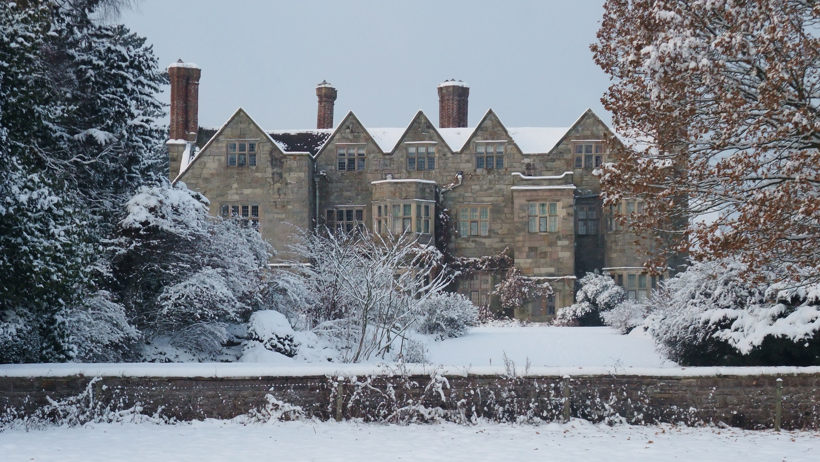 a snowy stately home