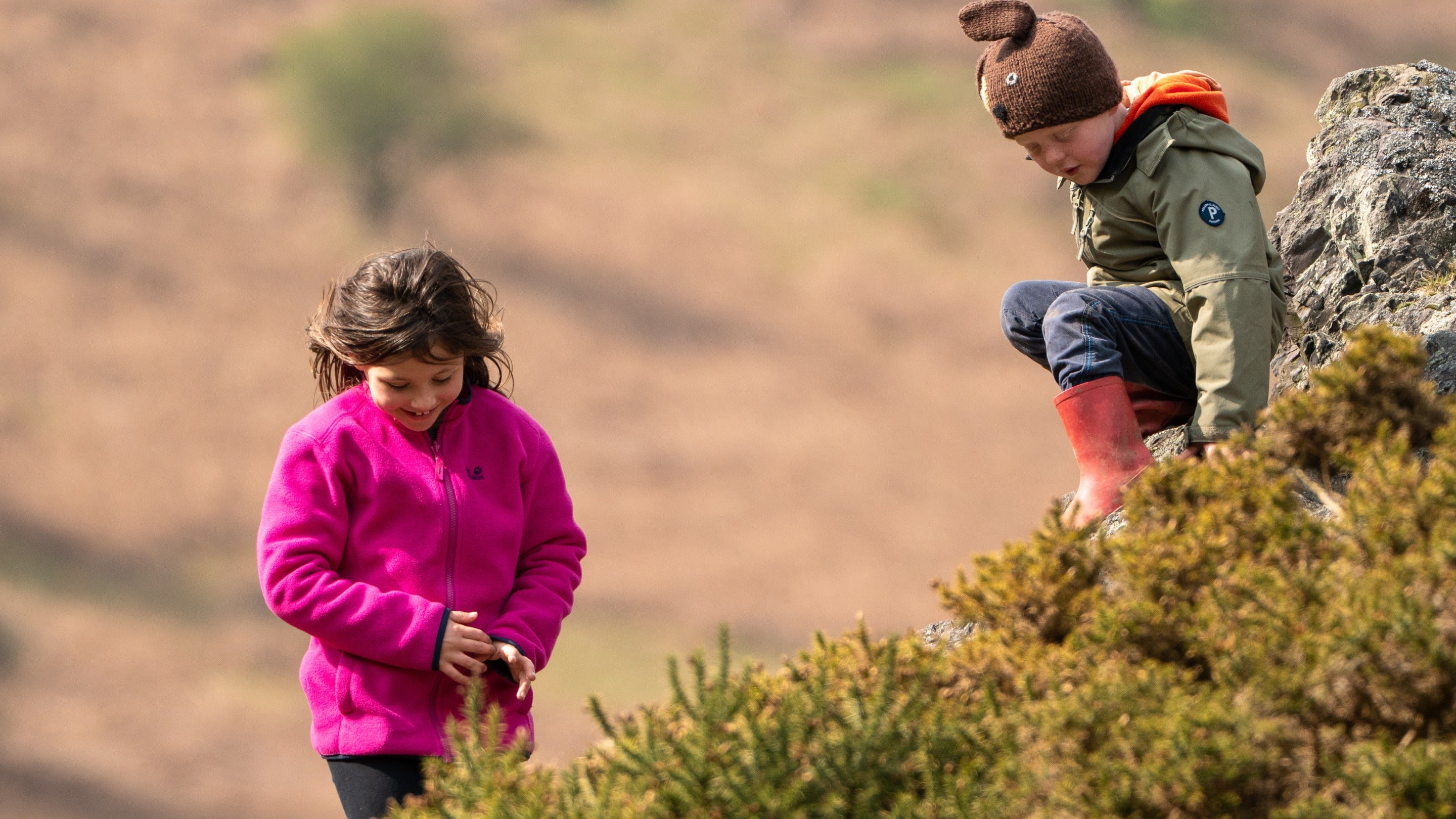 Children playing on the hillside at Carding Mill Valley and the Long Mynd, Shropshire
