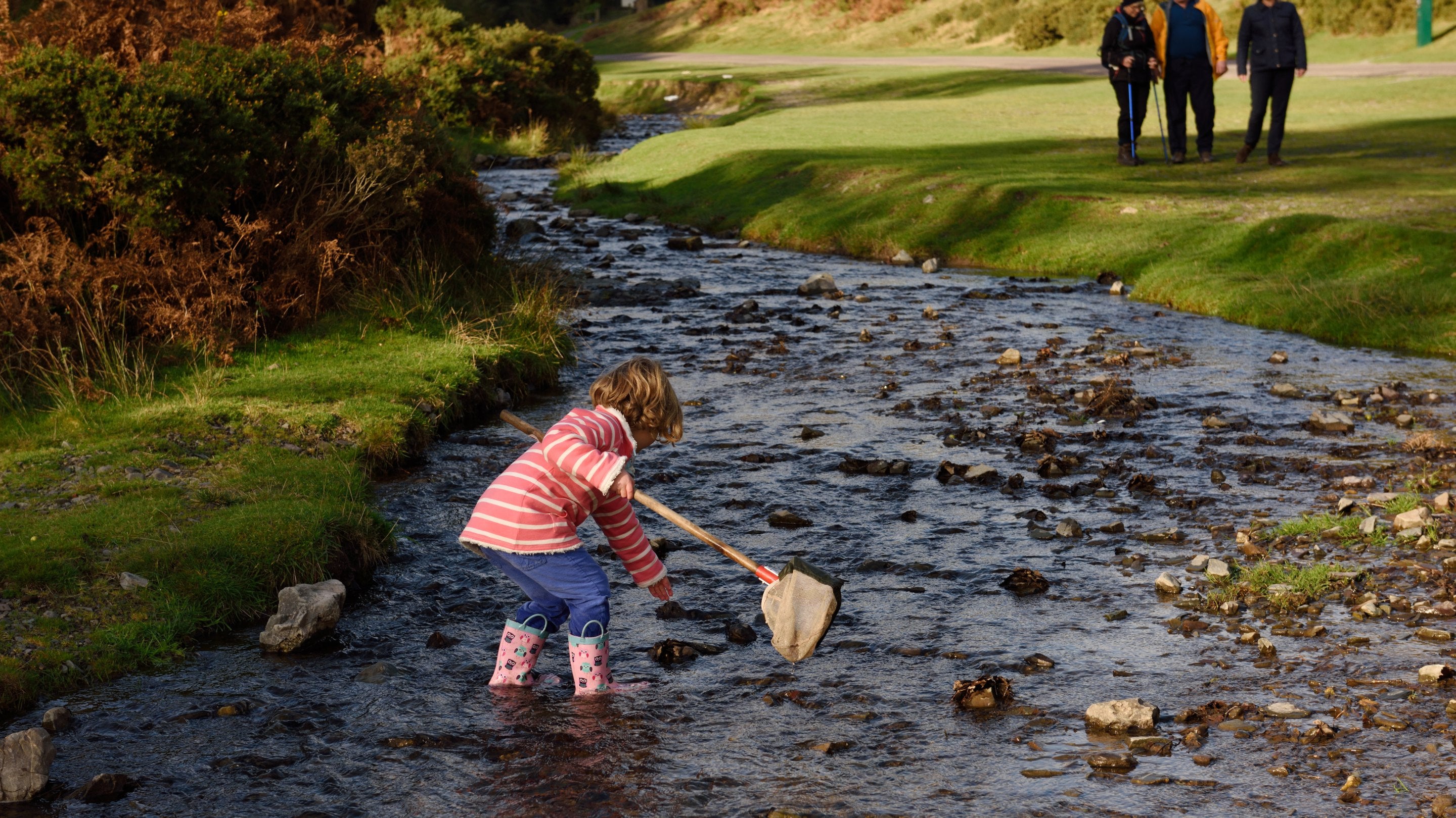 A girl with a fishing net at Carding Mill Valley and the Shropshire Hills, Shropshire