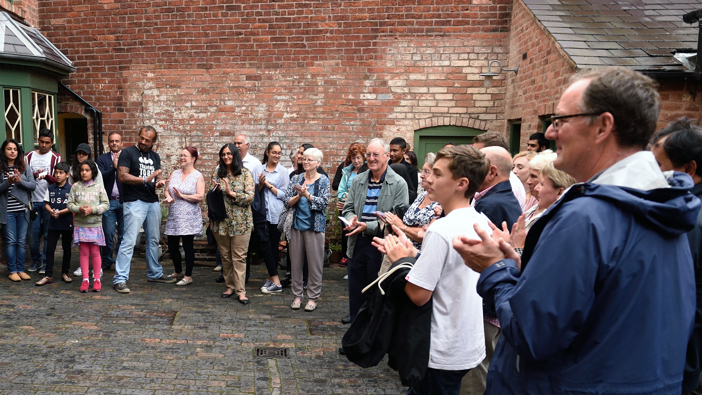 A group of visitors listening to a guided tour