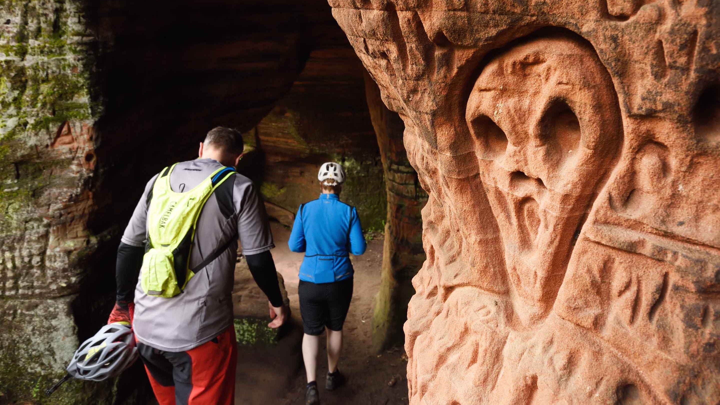 Visitors exploring the curious rock formations at Kinver Edge and the Rock Houses, Staffordshire