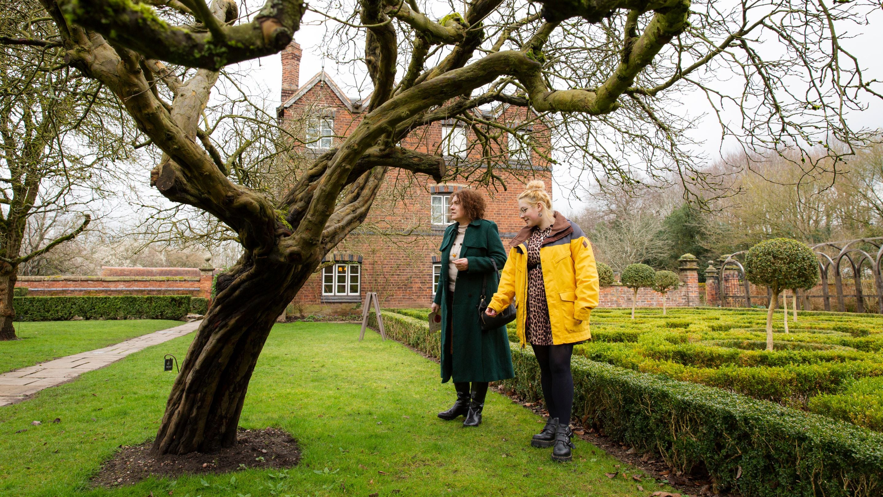 Visitors exploring the garden at Moseley Old Hall, Staffordshire