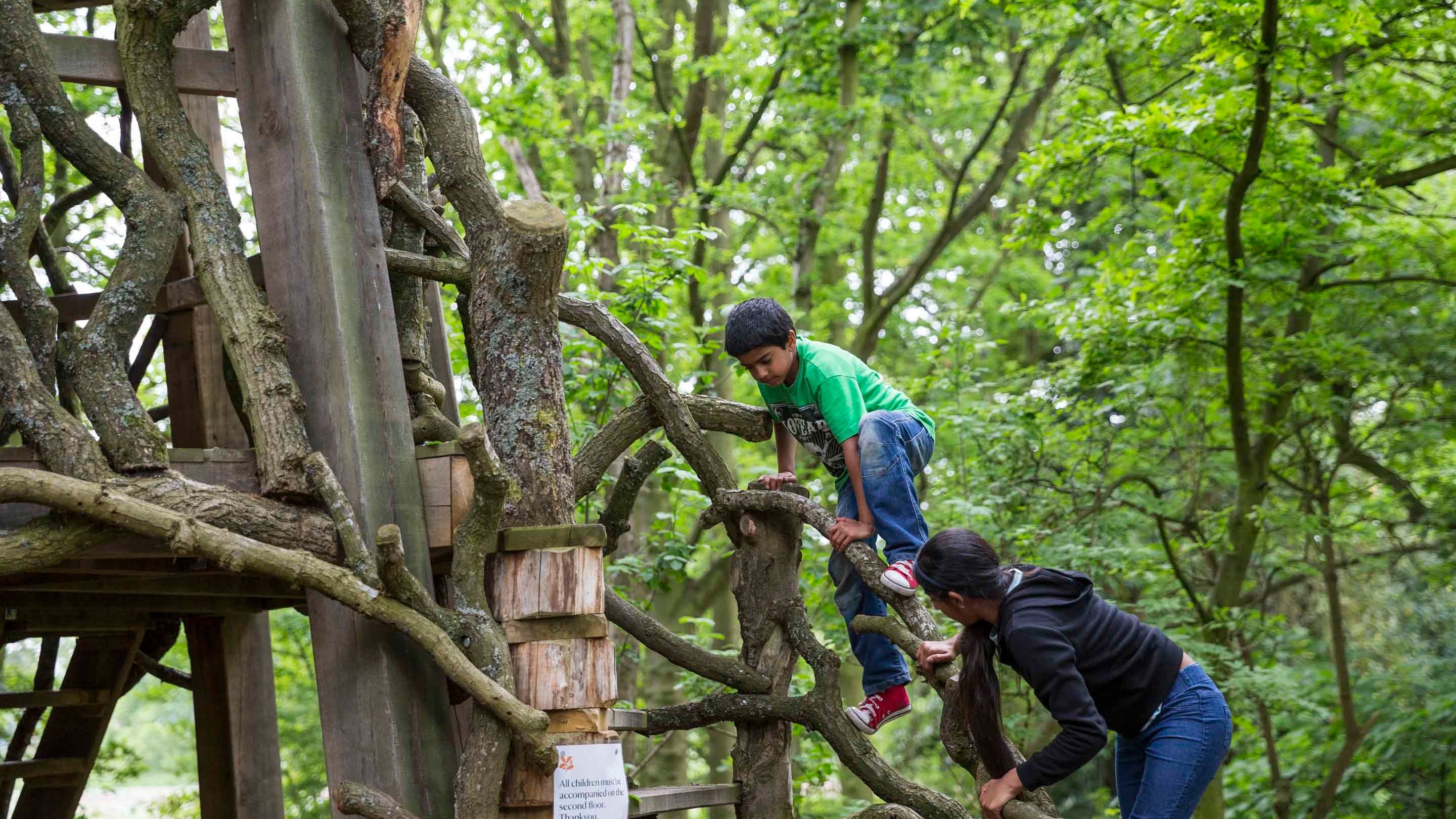 Children in the adventure play area at Moseley Old Hall, Staffordshire
