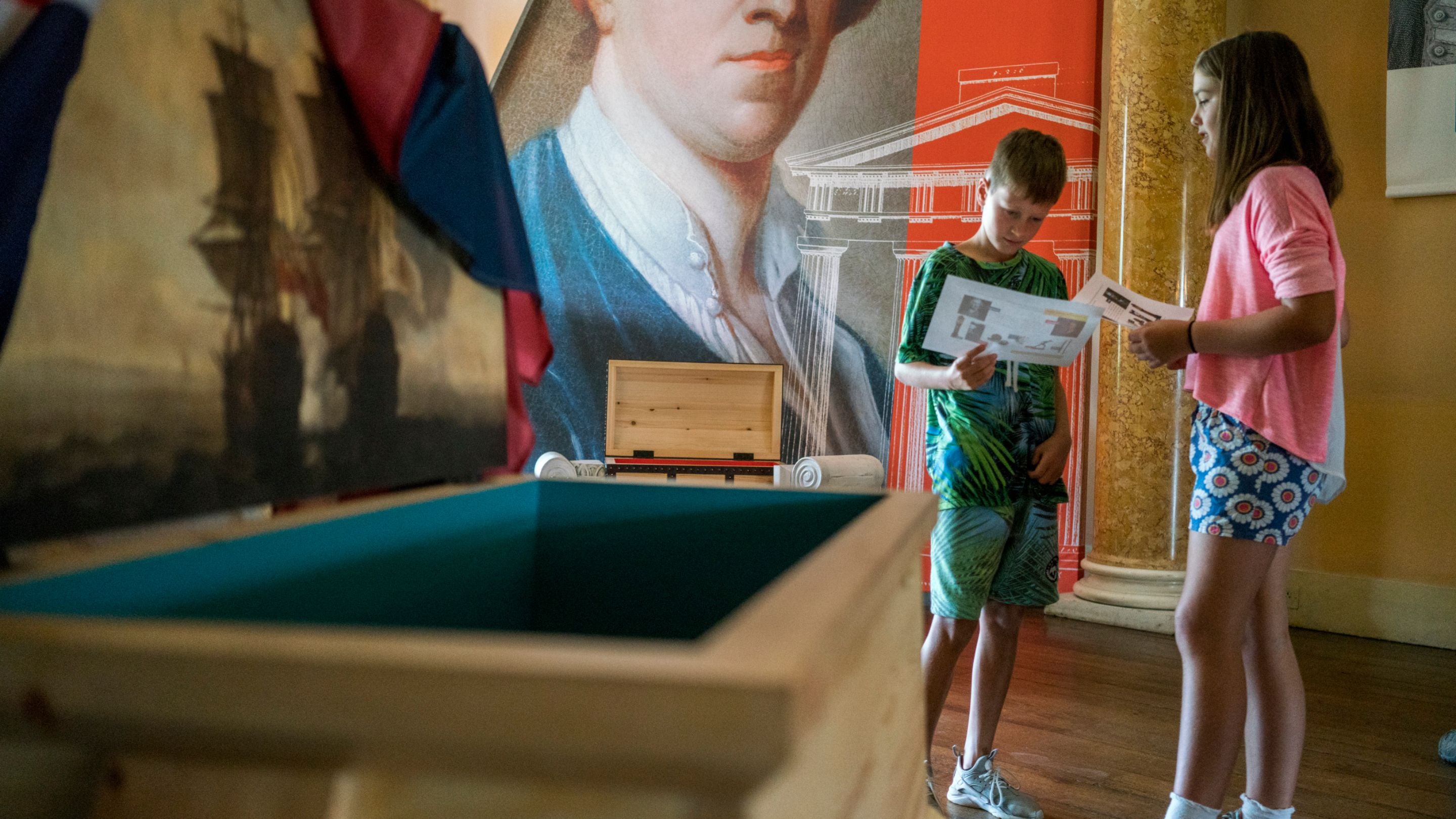 Two children looking around the house at Shugborough, Staffordshire.