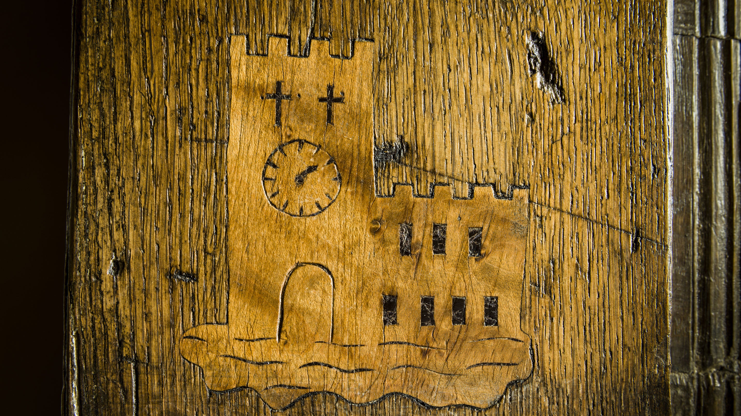 Close-up detail of wood carving of a church