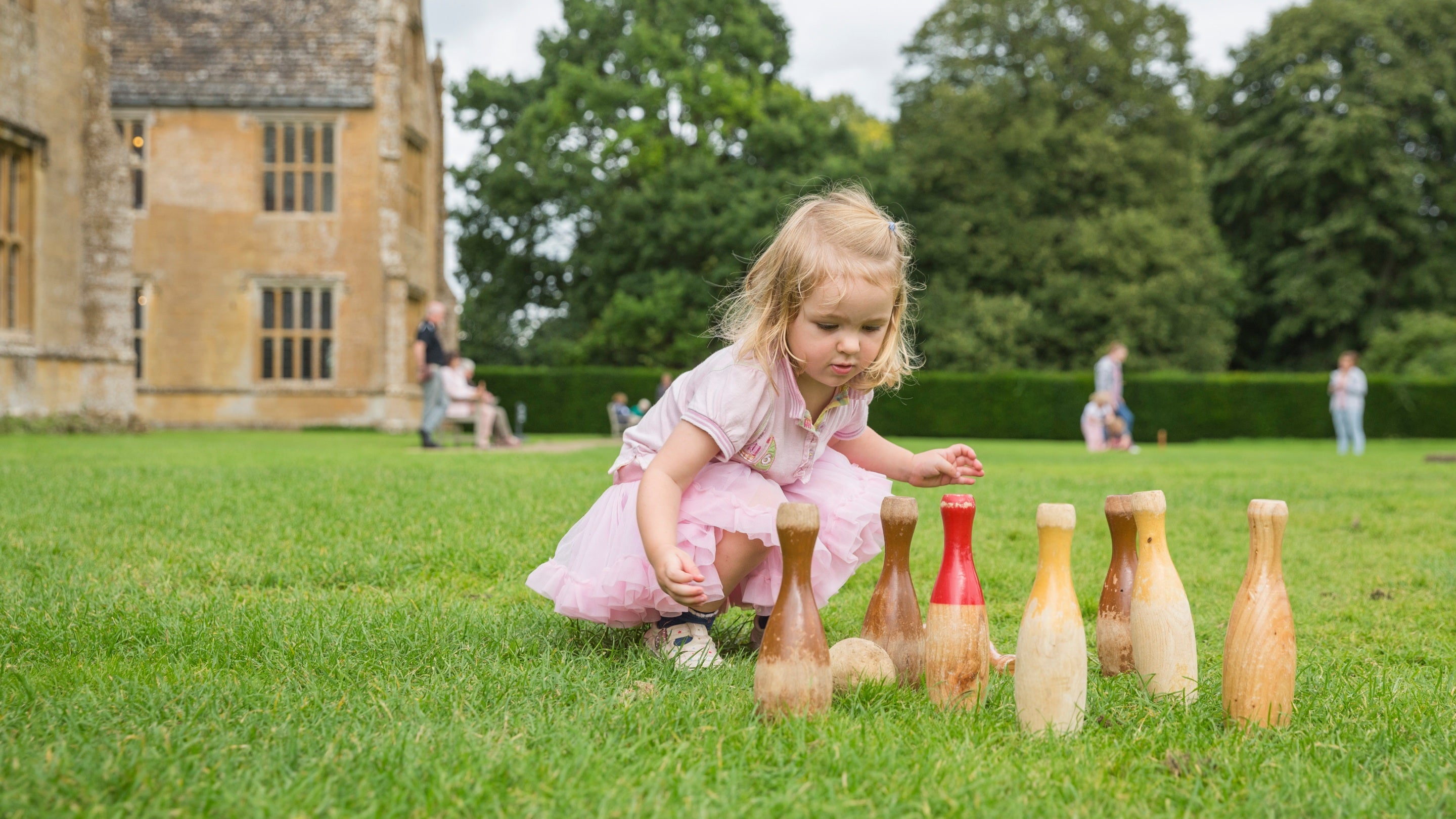 Playing skittles on the lawn at Barrington Court, Somerset