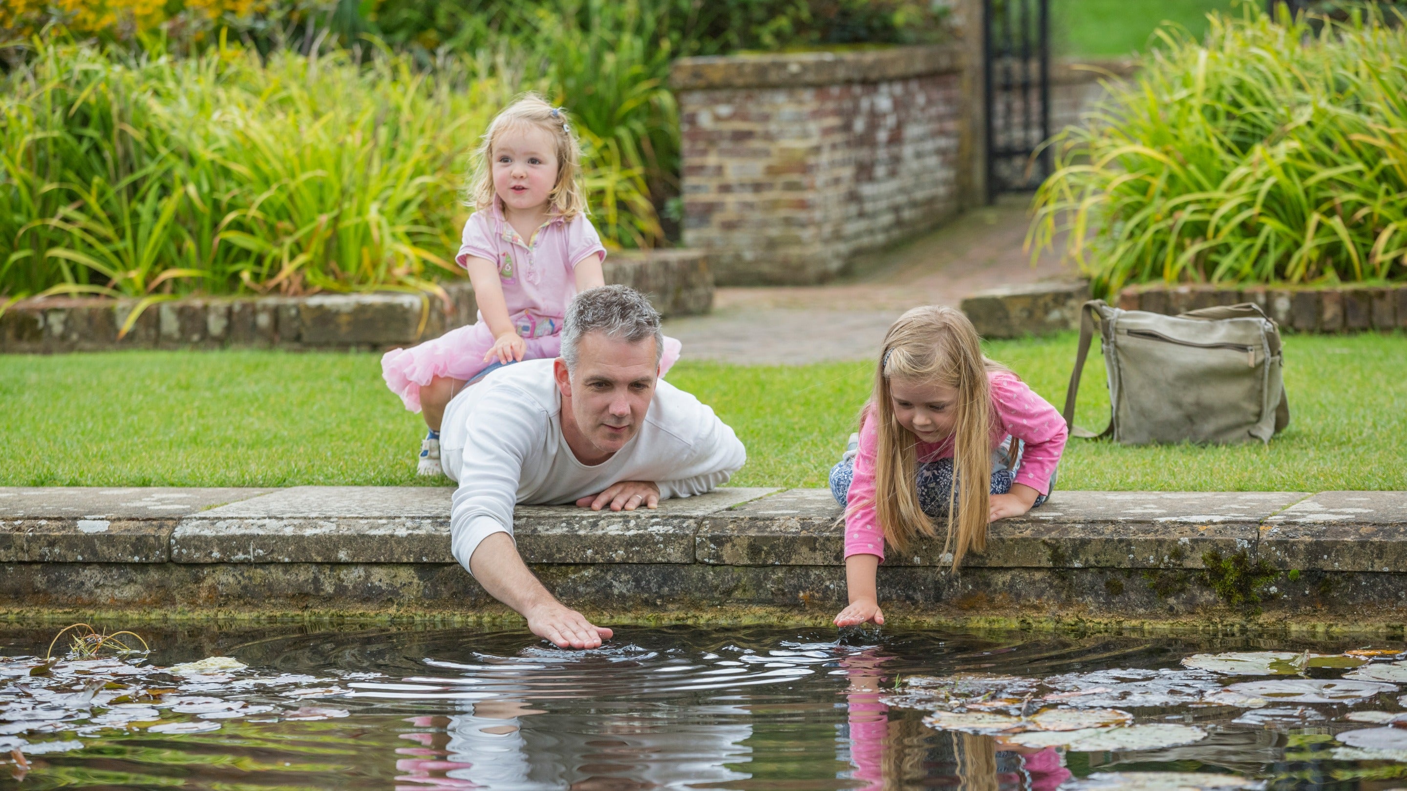 Visitors in the Lily Garden at Barrington Court, Somerset