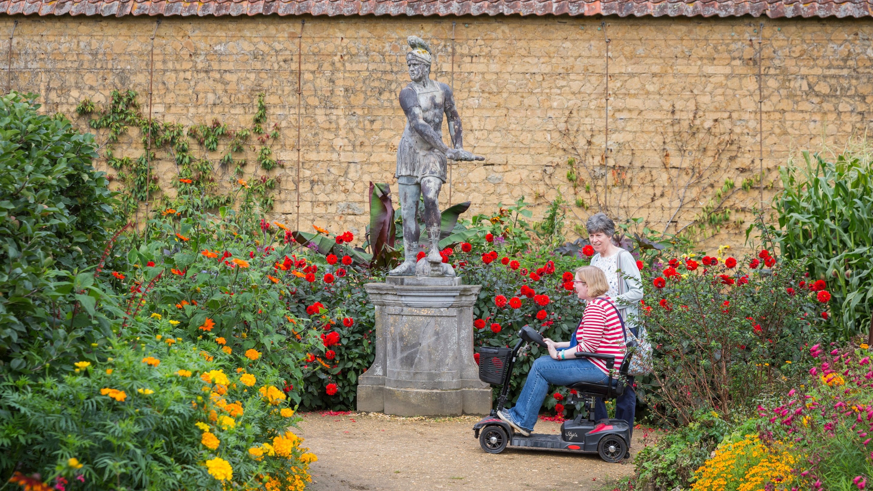 Visitors in the Walled Garden at Barrington Court, Somerset