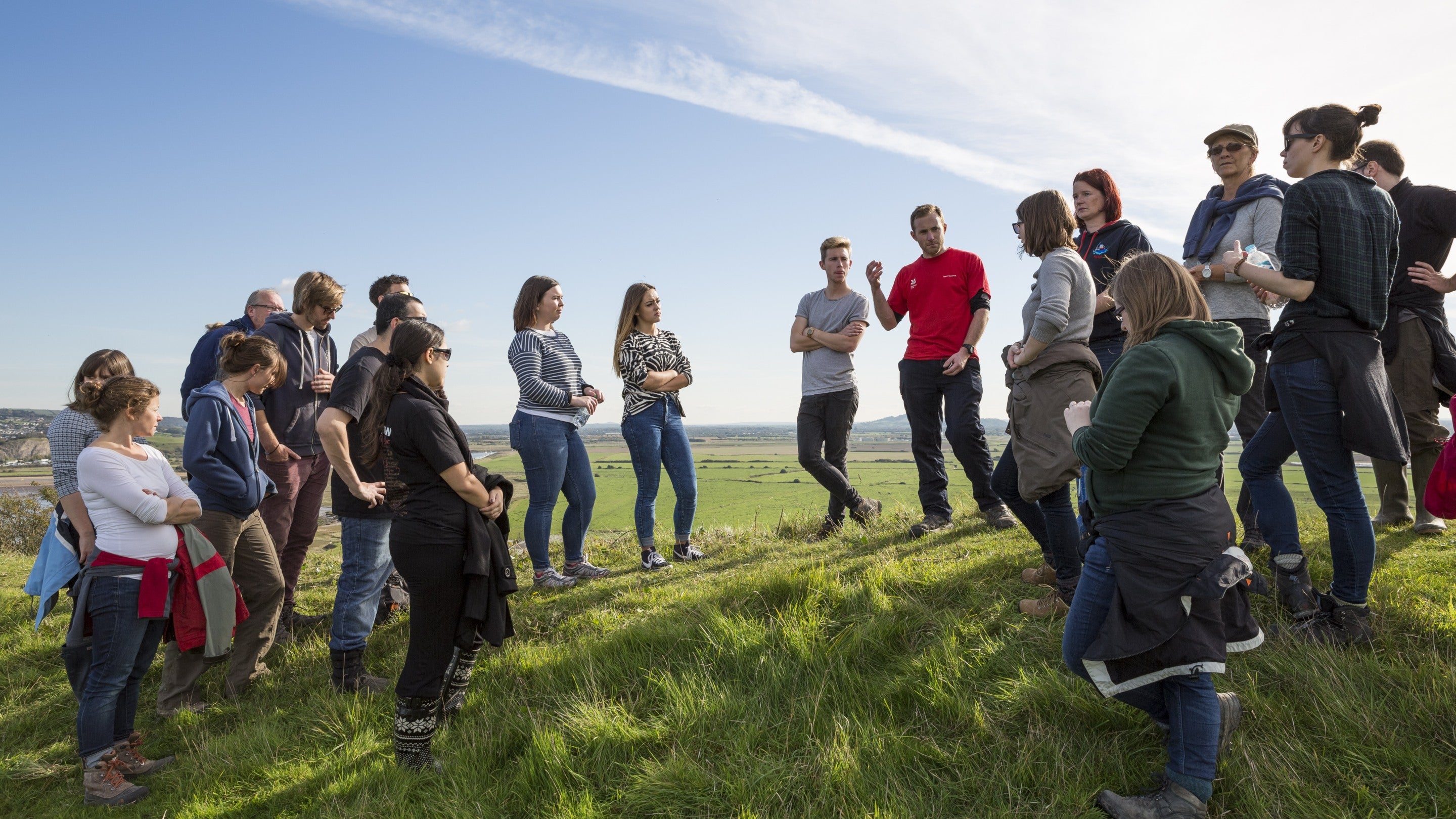 National Trust staff talking to volunteers before beginning work on Brean Down, North Somerset