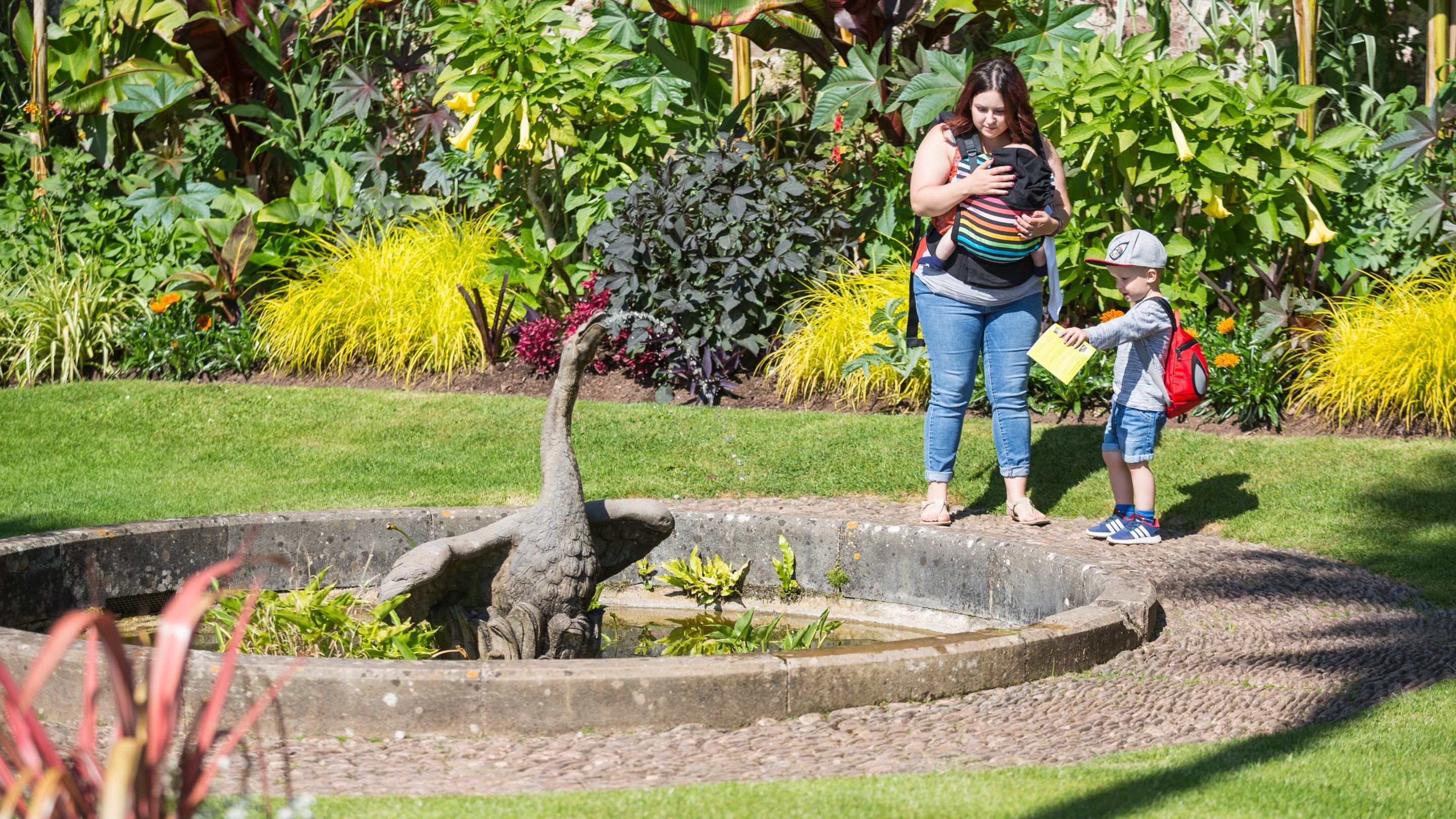 Visitors on the South Terrace in summer at Dunster Castle, Somerset