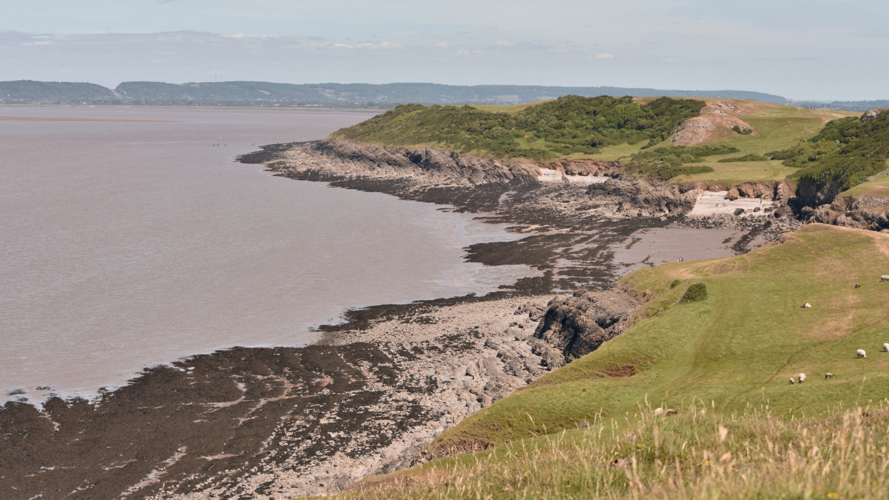 A view across the sea and land at Sand Point in Somerset, with rocky beaches and coastal views