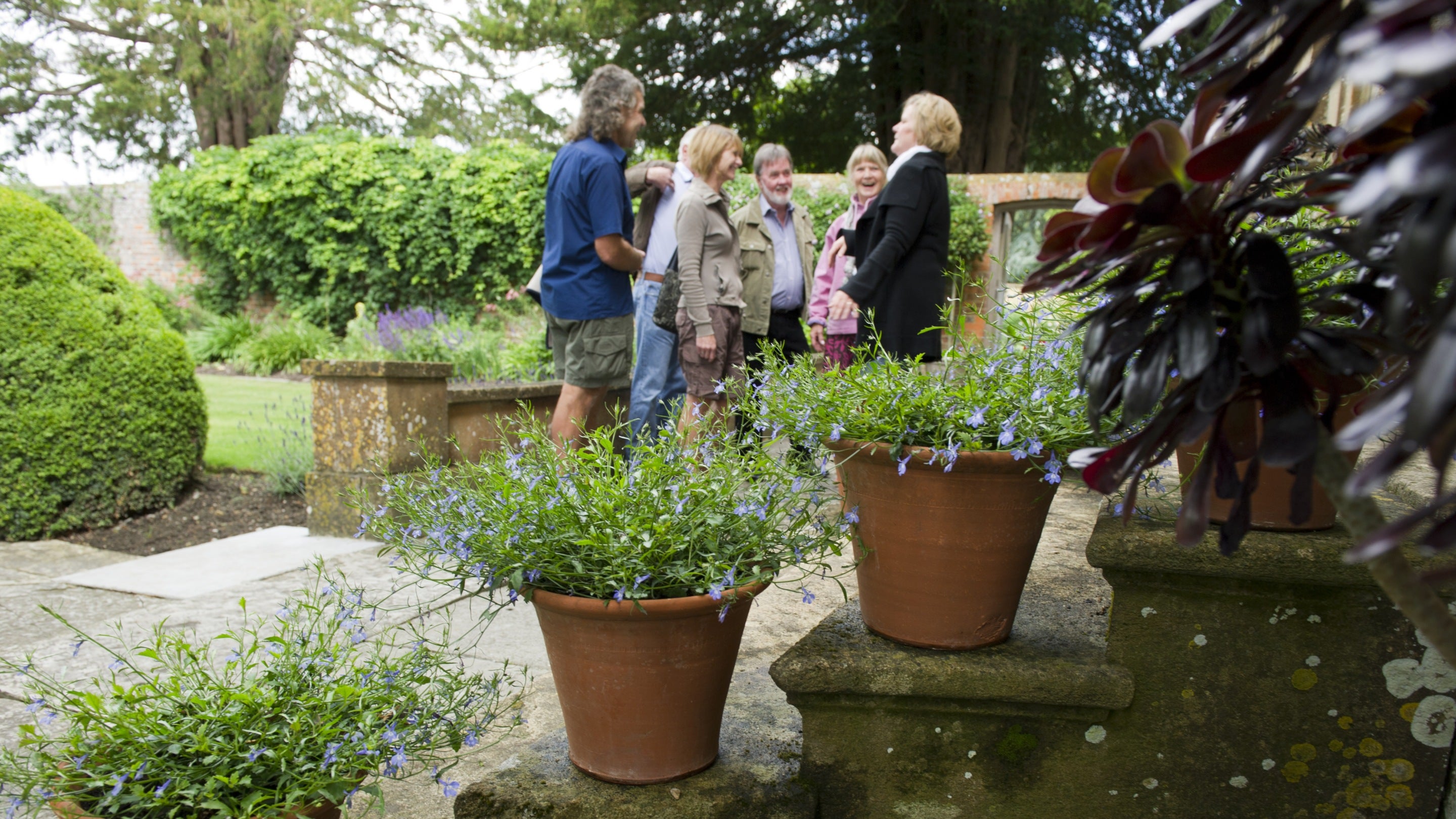 Visitors at the west front of the house at Tintinhull Garden, Somerset