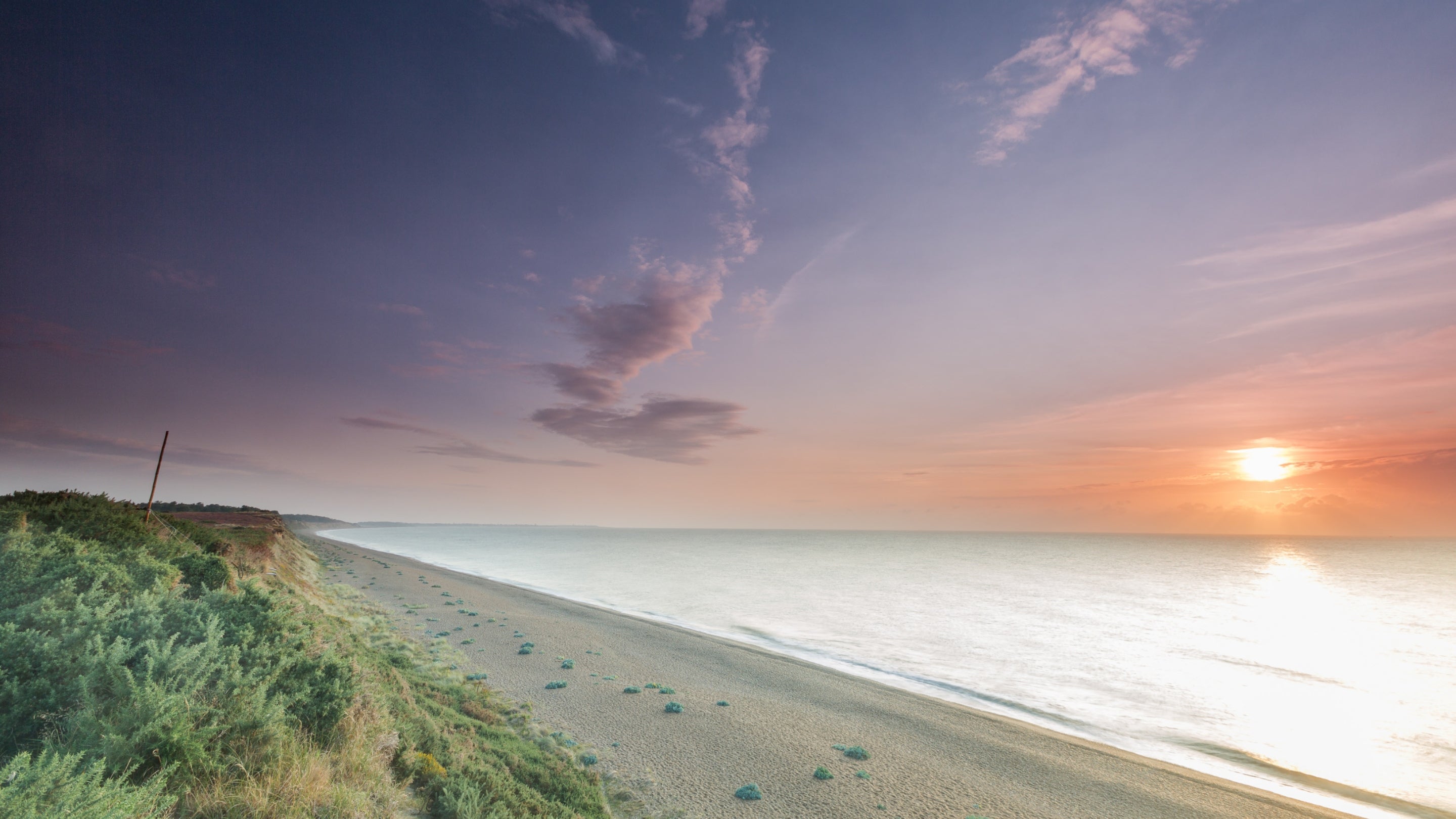 Sunrise over the sea at Dunwich Heath in Suffolk