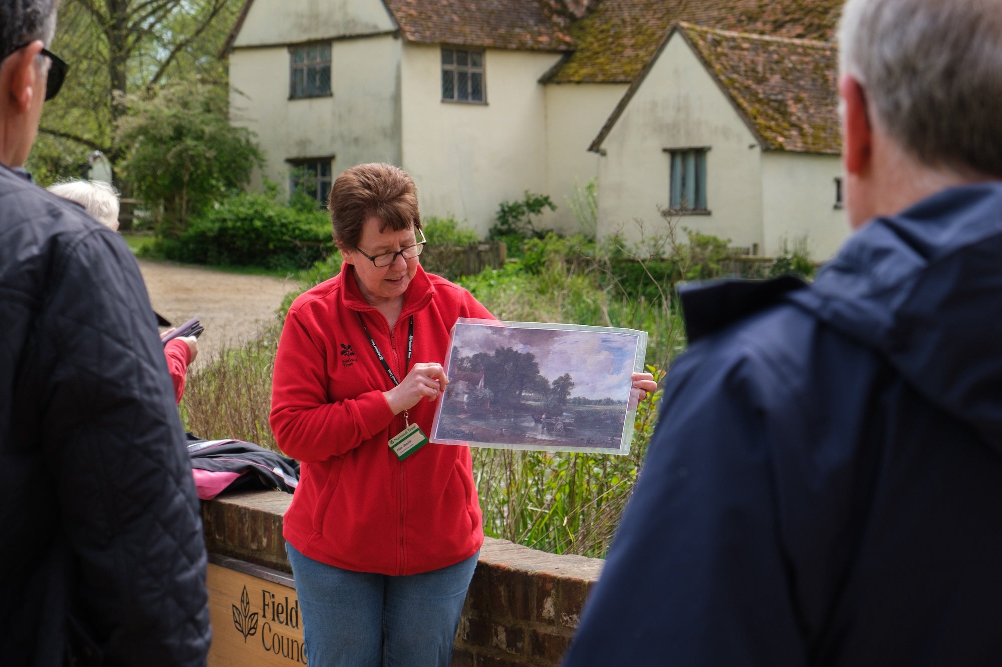A volunteer leads leads a guided tour of Flatford, Suffolk