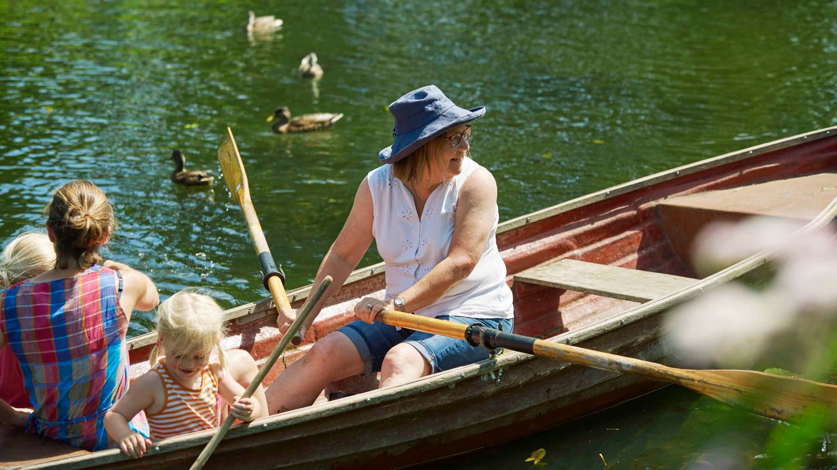 Family boating at Flatford, Suffolk